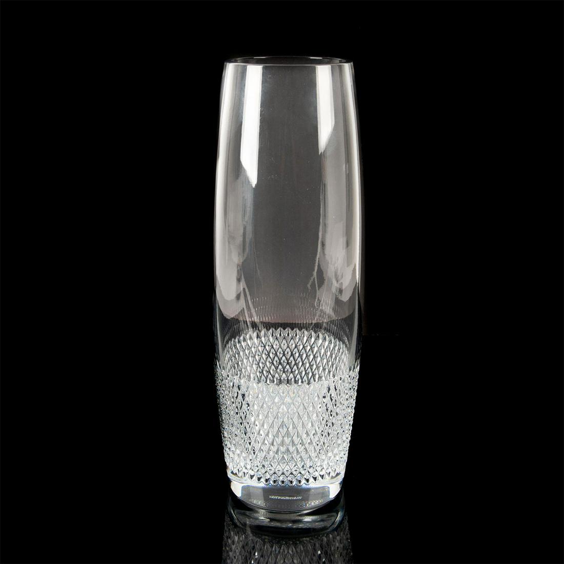 Waterford Crystal John Rocha Lume Vase: Lume Collection. Impressive clear crystal vase with dramatic band of striking cut crystal design on base. Stunning ovoid form statement piece with hand crafted fine crystal. John Rocha Waterford etche