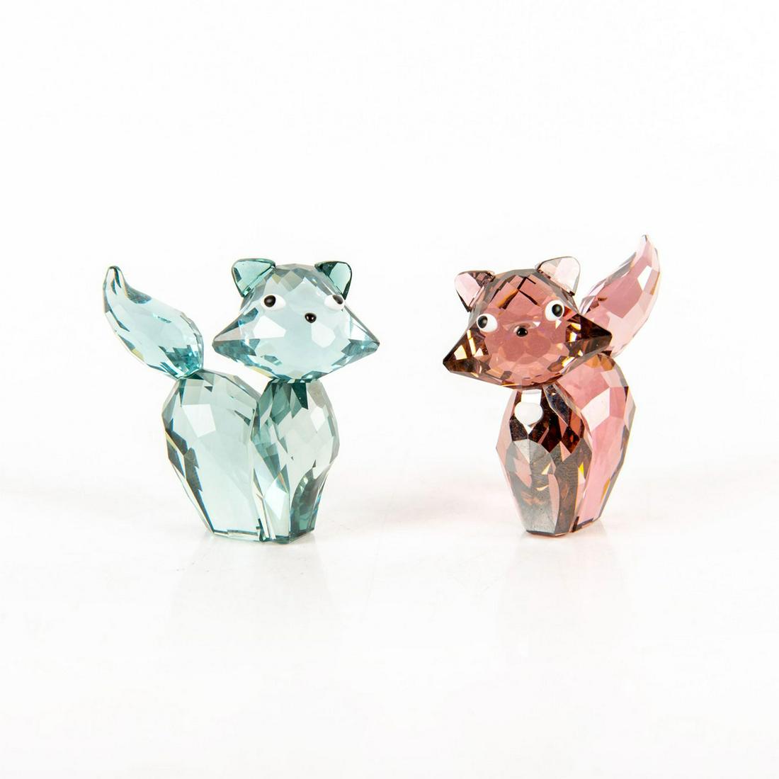 Pair of Swarovski Figurines, Lovlots Marie & Pierre: Part of the Lovlots House of Cats collection. Marie produced in kakadu red satin crystal with chalk white crystal heart. Swarovski swan backstamp. Pierre made of Indian sapphire. Swarovski swan backst