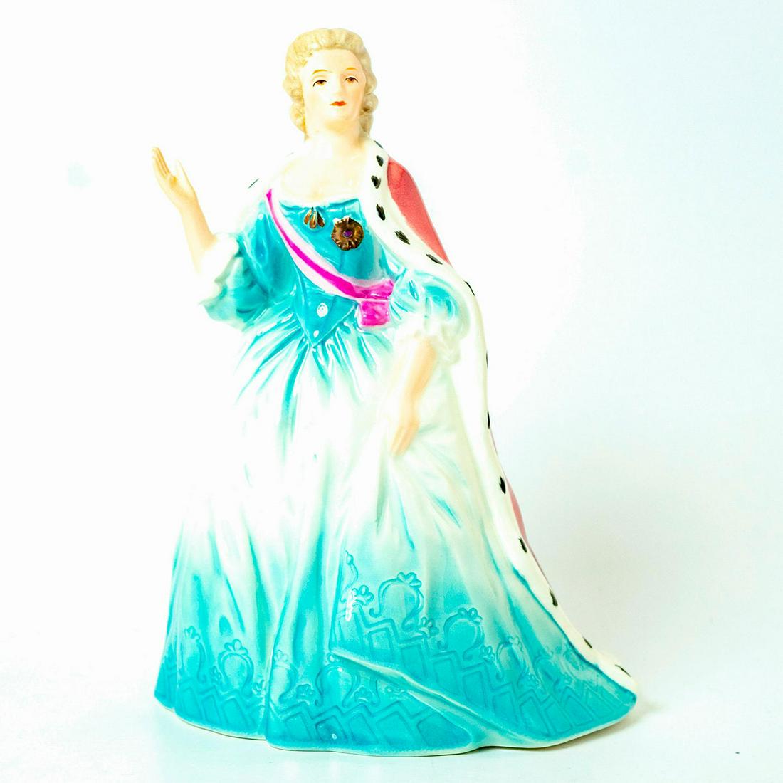 Goebel Porcelain Figurine, Katharina 1772: Part of the queen series, Katharina is elegantly dressed in a light blue gown with pink sash and royal dark red cloak. Goebel backstamp. Issued: 20th c. Dimensions: 8.5"H Manufacturer: Goebel Country