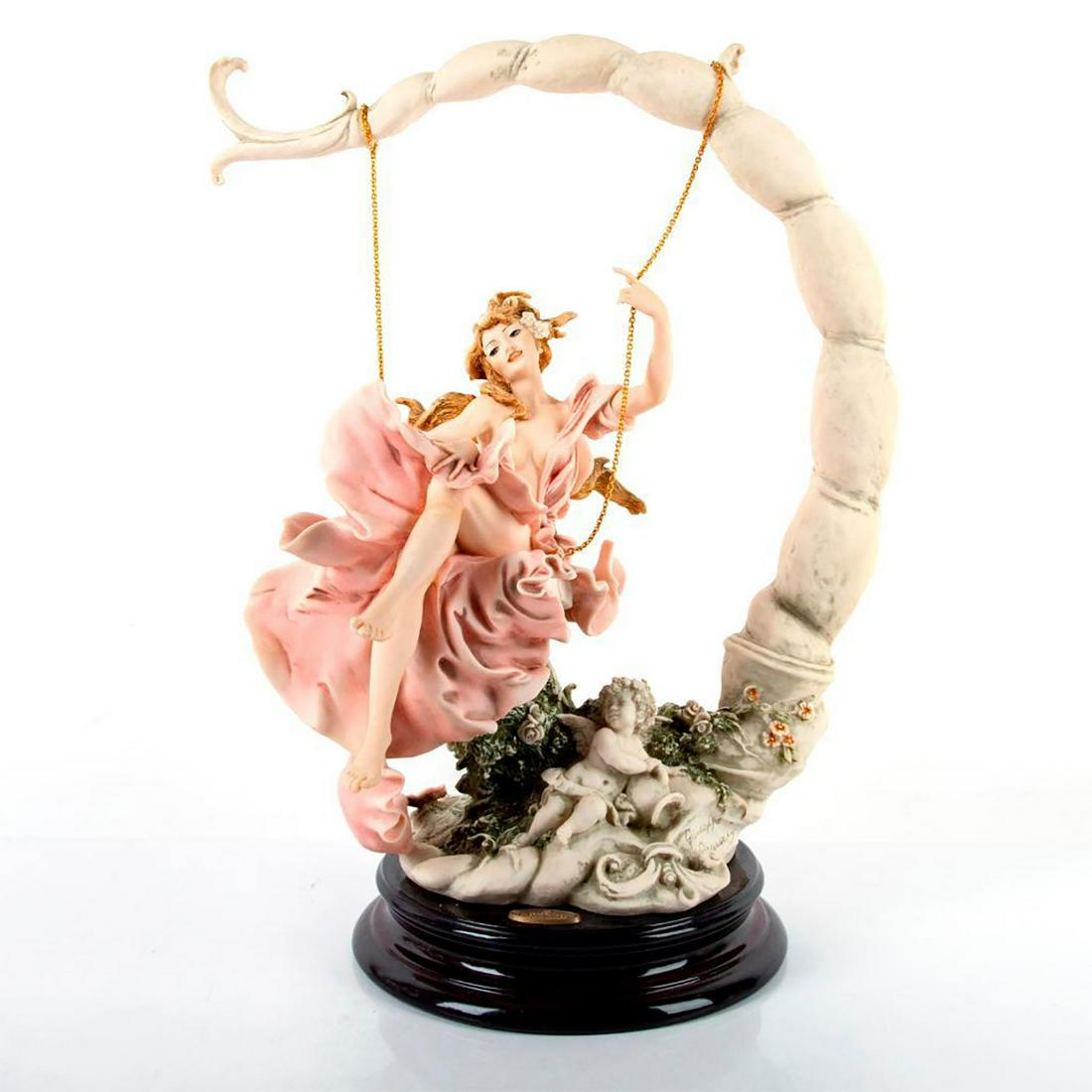 Capodimonte Florence Giuseppe Armani Swinging Girl: Pink dress, wood base. Half nude woman swinging from a curved branch. Limited edition. Giuseppe Armani signature, capodimonte stamp and florence imprint. Artist: Giuseppe Armani Issued: 20th c. Dimens