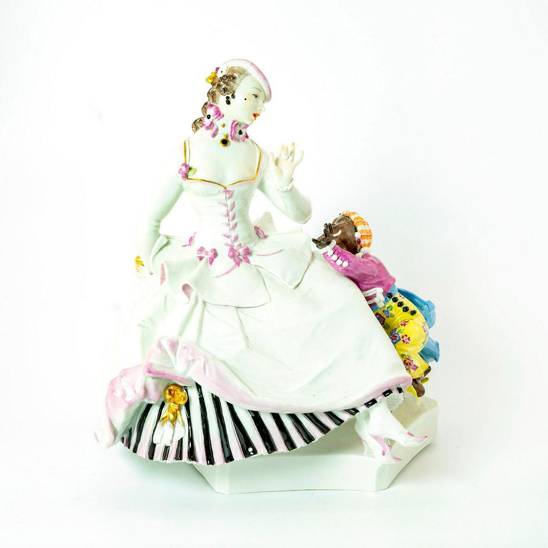 Meissen Porcelain Figurine Apple Tease: High gloss finish; Elegant lady keeps a gold gilt painted apple from a little girl. Meissen backstamp. Issued: 19th c. Dimensions: 11.5"H Manufacturer: Meissen Country of Origin: Germany