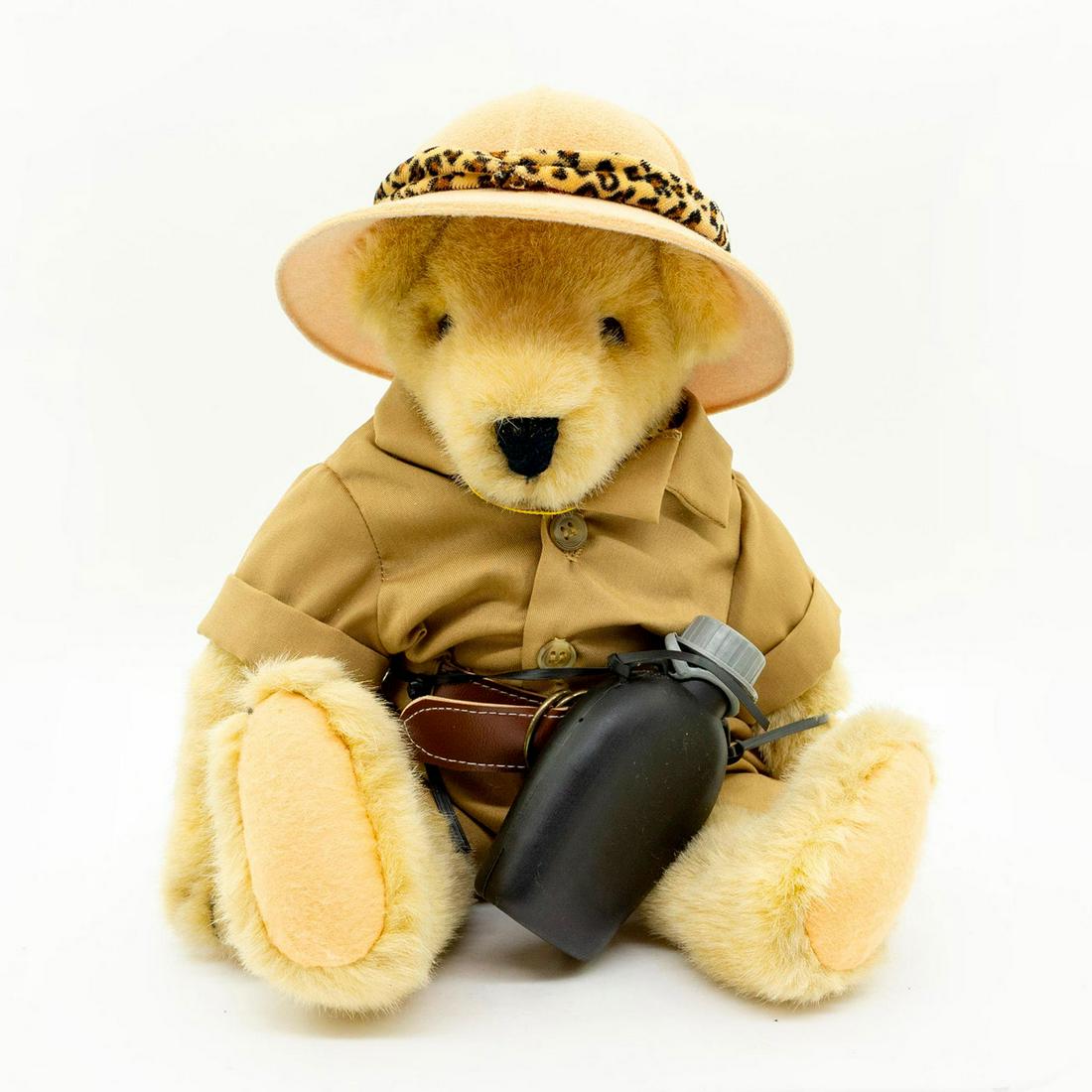 North American Bear Co Teddy Bear, Out Of Africa: Classic safari outfit and hat with leather-print trim. Carries a black canteen. VanderBear collection. Fully jointed. Manufacturer tag attached. Artist: Odl Bauer Manufacturer: North American Bear Co.