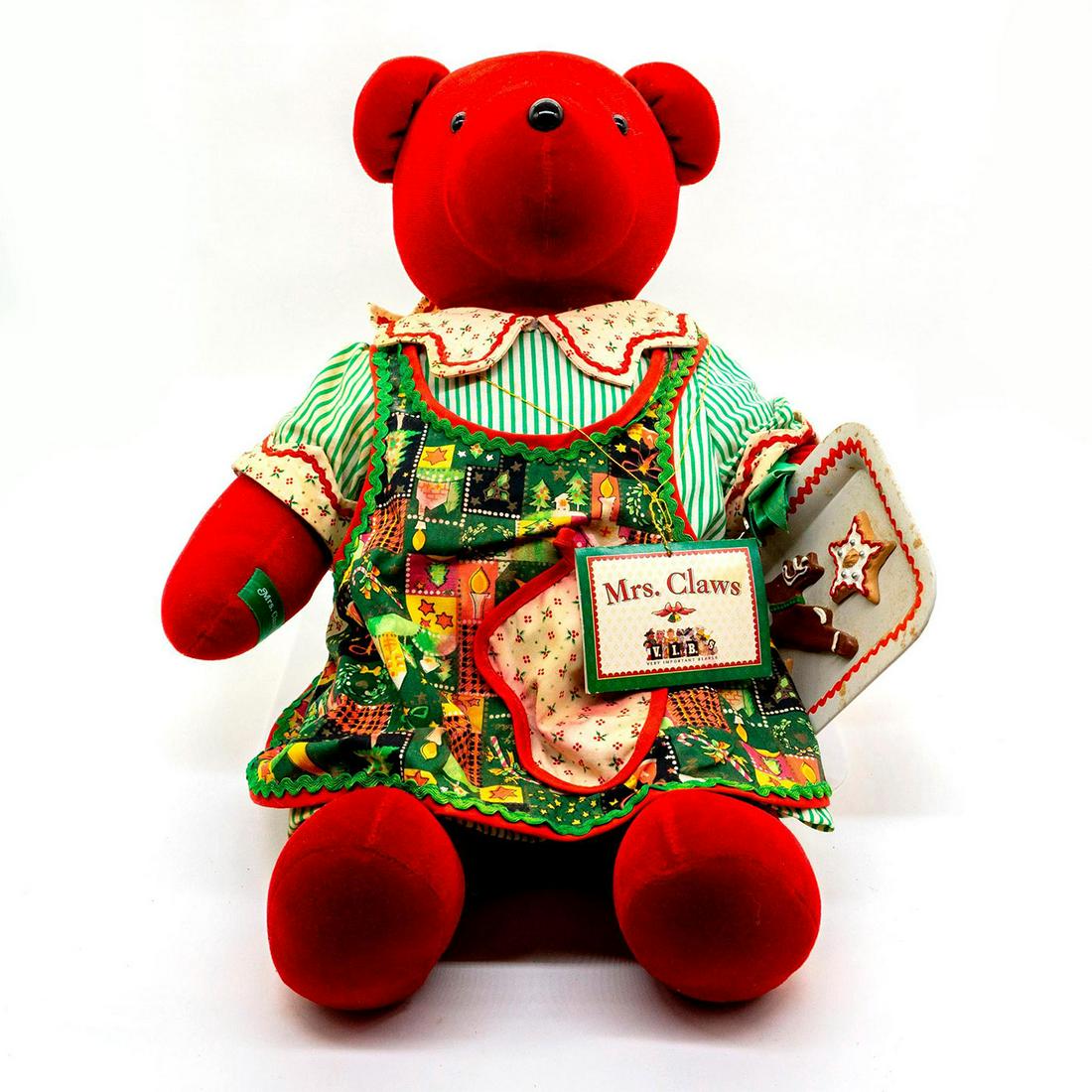 North American Bear Company Teddy Bear, Mrs. Claws: Plush, wearing a Christmas apron and outfit, also holding a tray of cookies. Original tag attached. Issued: 1992 Dimensions: 21"H Manufacturer: North American Bear Company Country of Origin: United St