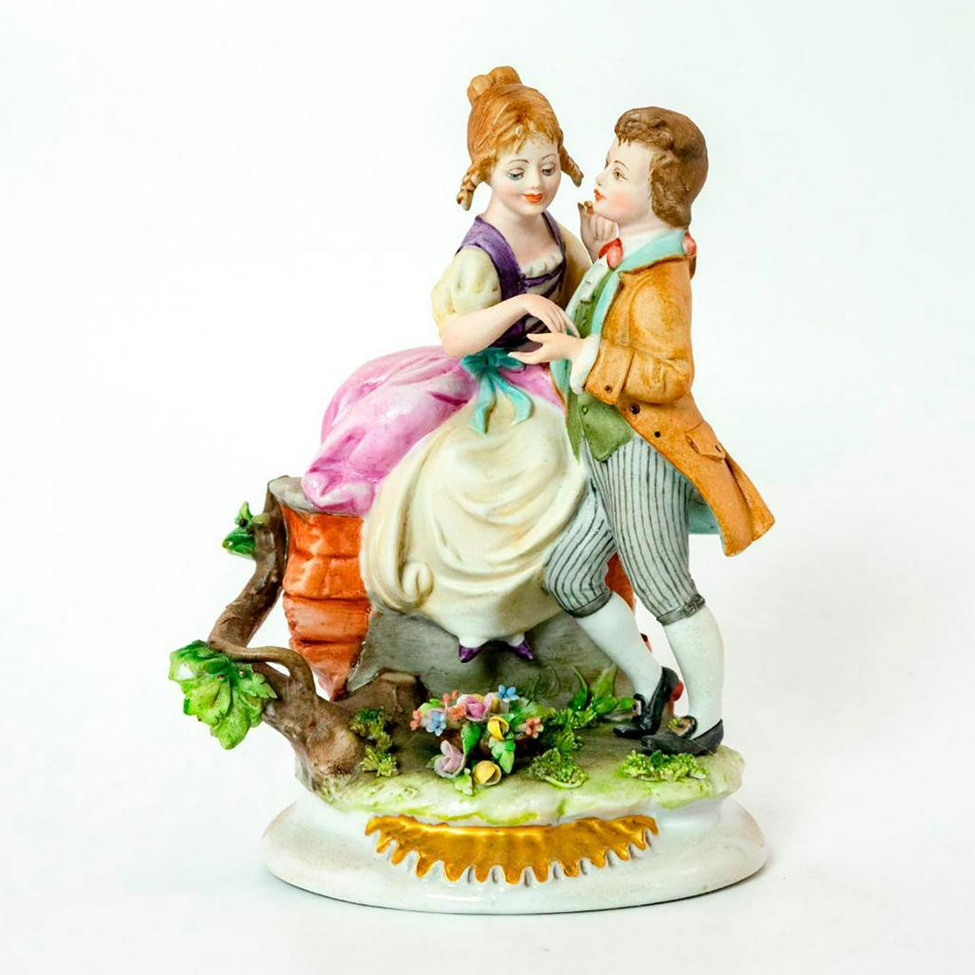 Capodimonte Figurine, Courting Couple: Modelled as young girl and boy courting. Porcelain; matte finish; applied flowers; gilt accents. Capodimonte backstamp. Chipped petal. Issued: 20th c. Dimensions: 6.75"H Manufacturer: Capodimonte Coun