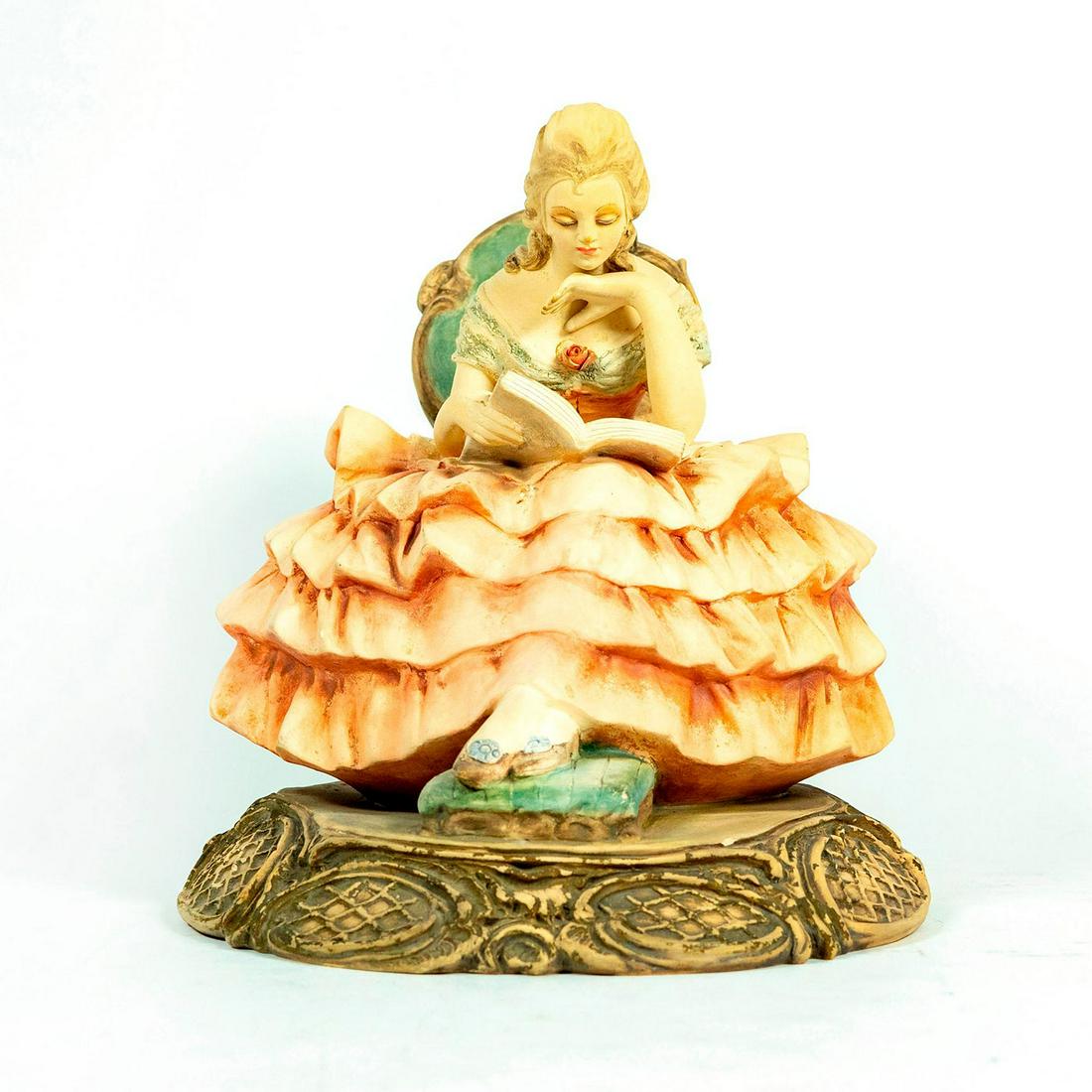 Guido Cacciapuoti Figurine, Woman Reading: Seated woman reading a book. Large model; matte finish. Signed G Cacciapuoti. Age related wear Artist: Guido Cacciapuoti Issued: 20th c. Dimensions: 10.25"H Country of Origin: Italy