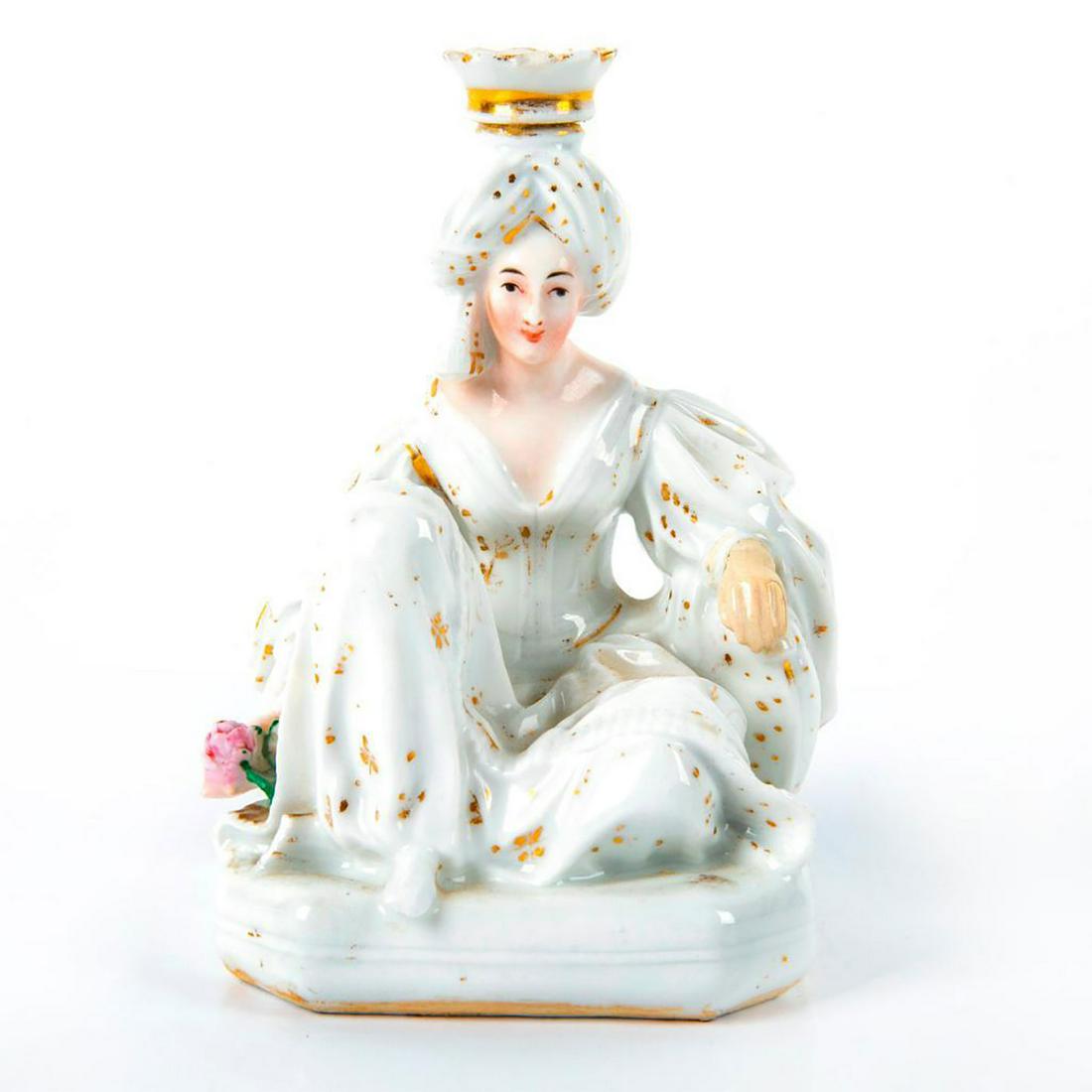 Jacob Petit Porcelain Candle Holder: Seated figure of a sultana in turban. White glazed porcelain with gilt accents. Initialed JP. Age related crazing; chipped feet and crack to head. Issued: 20th c, Dimensions: 5.5"H Manufacturer: Jacob