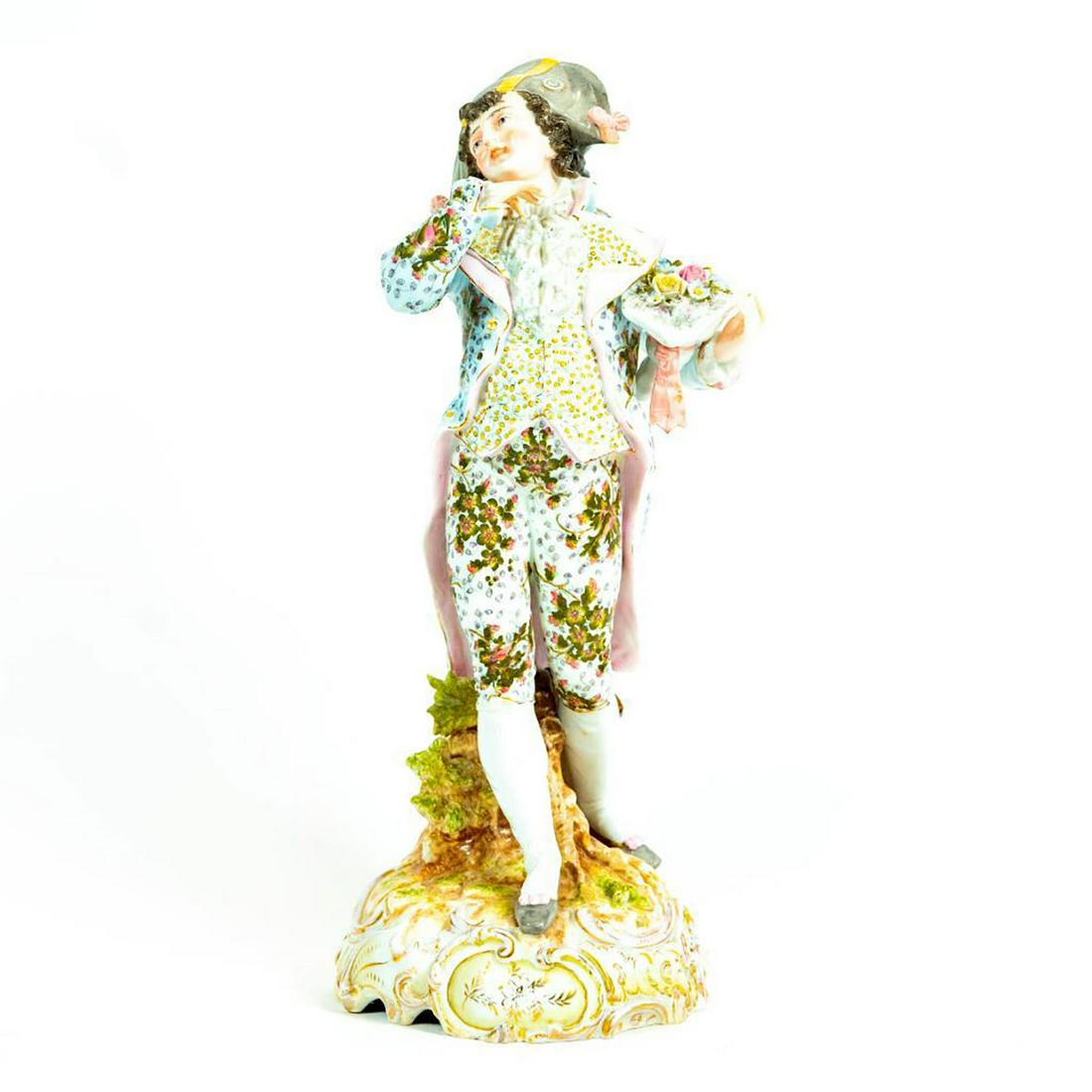 Volkstedt Porcelain Figurine, Man Floral Suit: Man in floral light blue and pink suit with bicorne hat. Volkstedt backstamp. The crossed pitchforks were the factory mark from 1760. Issued: 1760-1894 Dimensions: 14"H Manufacturer: Georg Heinrich Ma