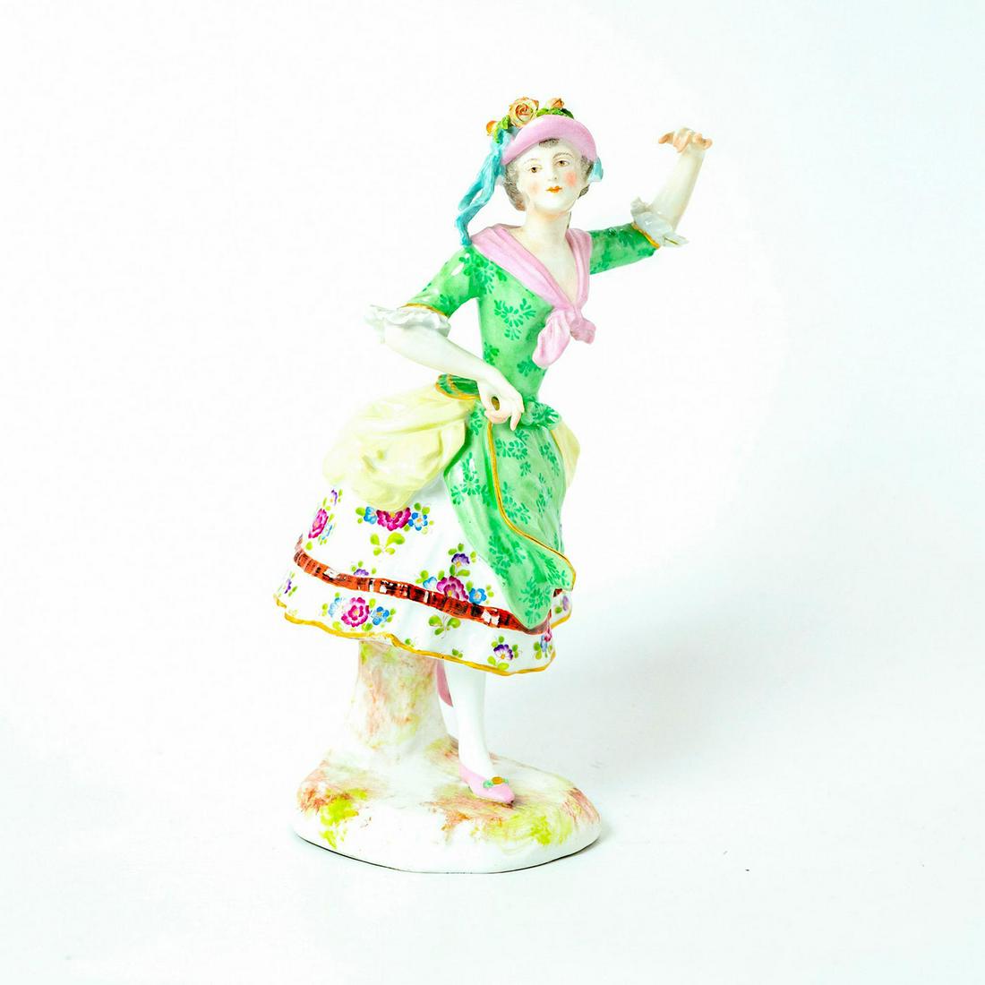 20th Century Porcelain Lady Figurine: Glazed porcelain; green, pink and yellow coloration; finely painted floral pattern; gilt accents. Age related wear; chipped petal. Issued: 20th c. Dimensions: 9"H