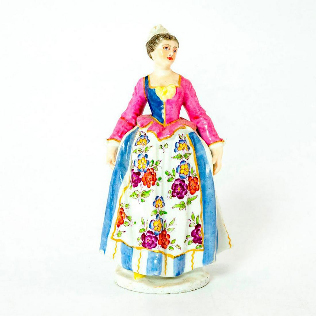Porcelain Hand Painted Lady Figurine: Vintage woman wearing pink and blue dress with flower designs. Backstamp. Issued: 20th c. Dimensions: 4"H