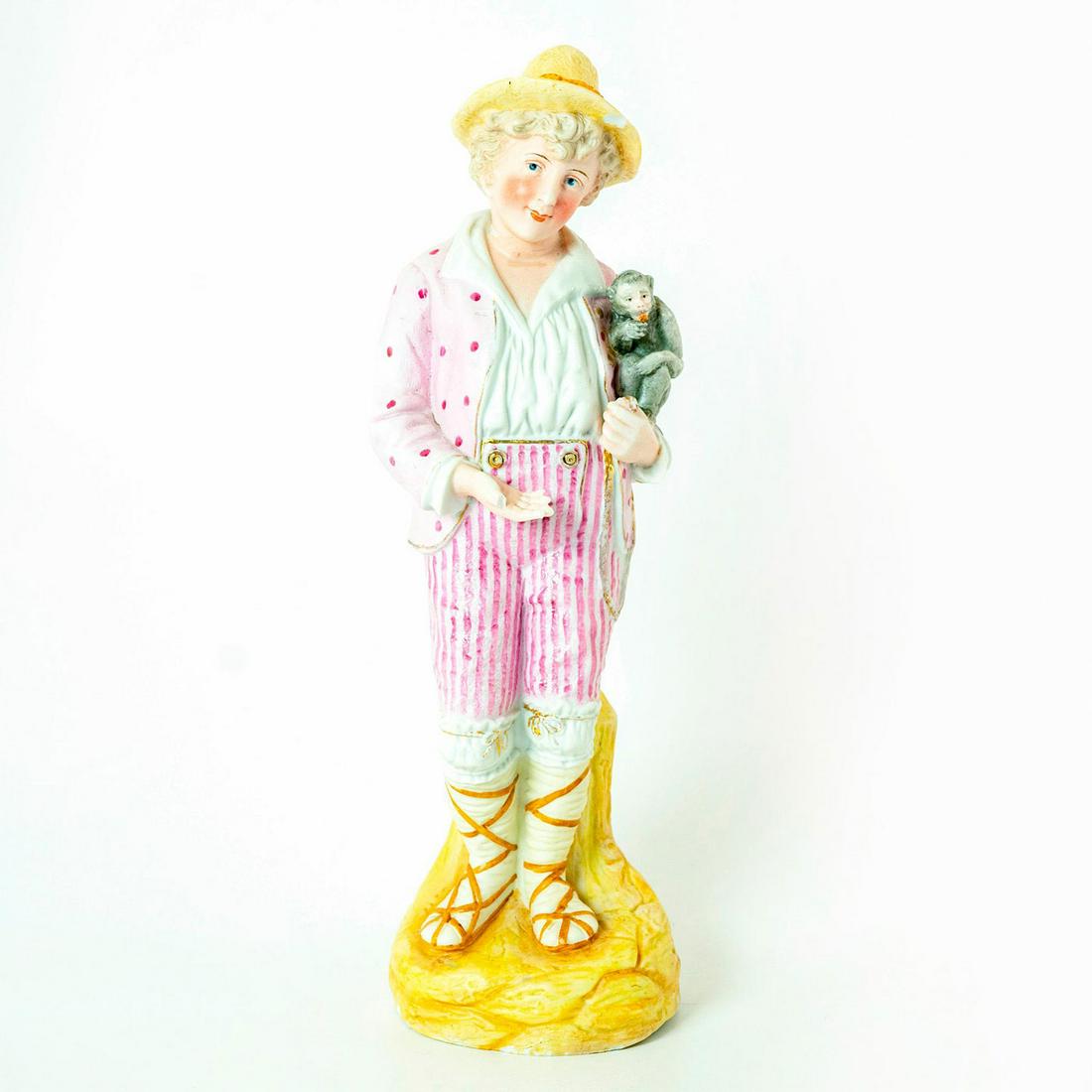 Vintage European Porcelain Figurine Man with Monkey: Matte finish figurine; Pink coloration with polka dots and stripes. Grey monkey. Missing right thumb. Issued: 19th c. Dimensions: 15"H