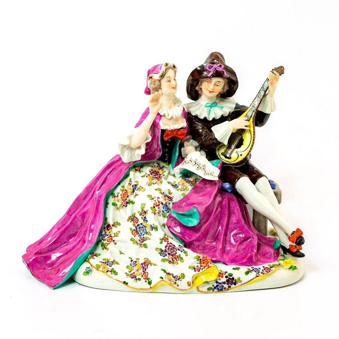 Vintage Porcelain Figurine Grouping, Musical Couple: Seated mandolinist with lady holding music sheets. Hand painted glazed porcelain. Stunning piece with exquisite detail; finely painted floral design; applied flowers. Chipped petals. Issued: 20th c. D