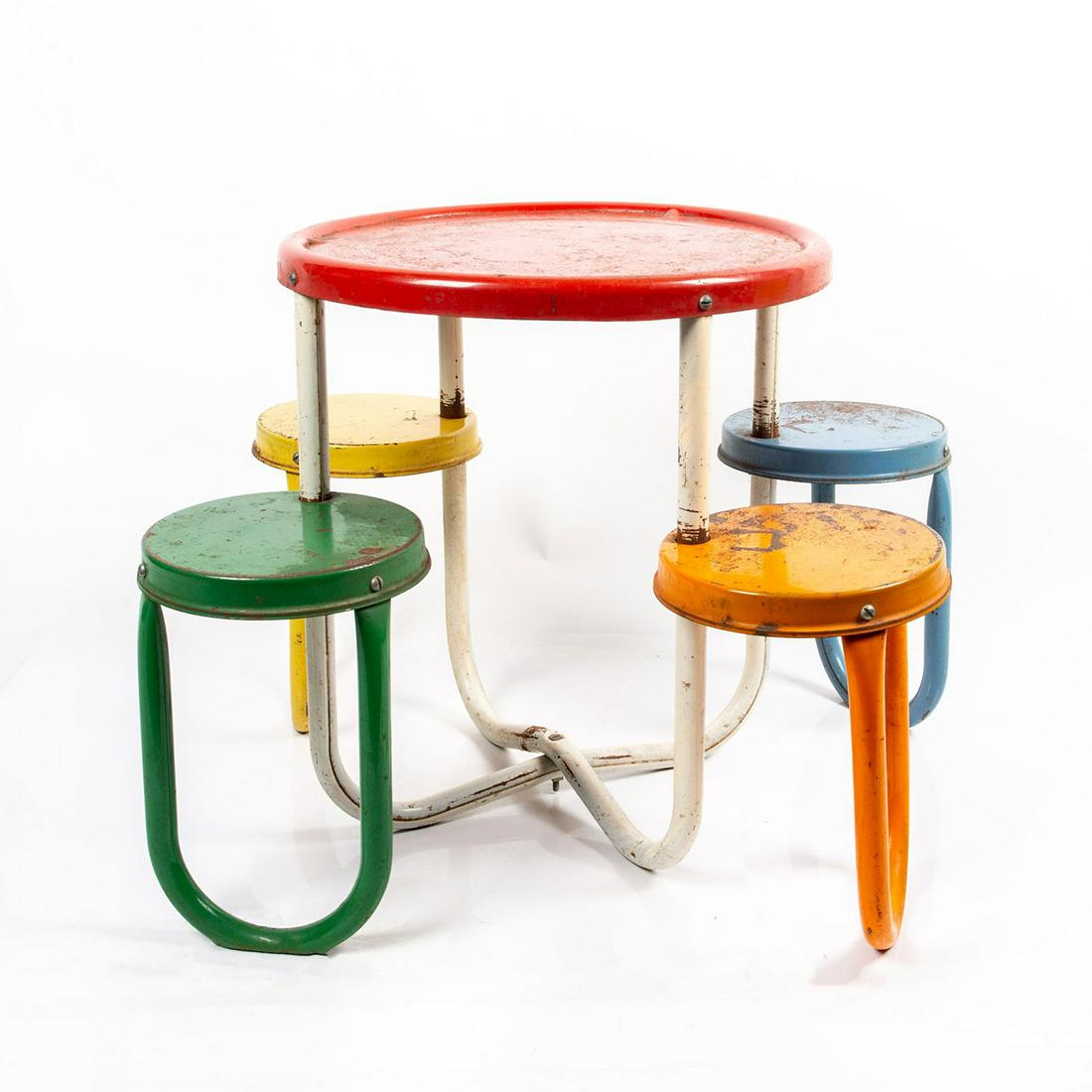 Outdoor Children's Playground Metal Table with Seats: An outdoor, metal, children's table with rotating seats that tuck under the table. Table is 21"H and seats are 13"H. Red Table with yellow, blue, orange and green seats. Heavily worn with rust showing