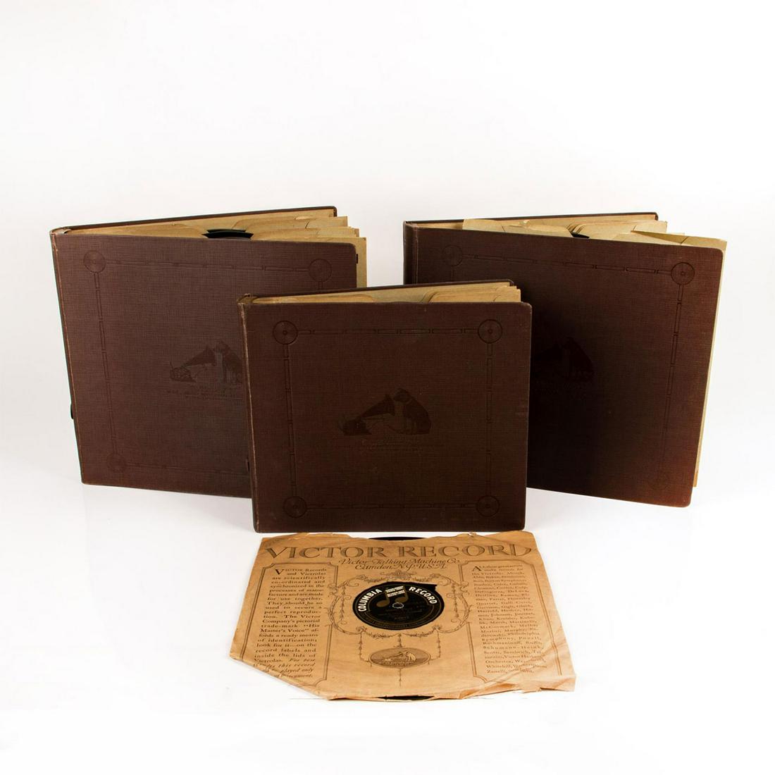 THREE VICTOR VICTROLA RECORD ALBUMS OF RECORDS: Over 30 Antique/Vintage musical records for a Victrola. This lot includes 30 Victor Victrola records encsed in 3 origonal album books complete with the Victor record dog and Victrola symbol " His Mast