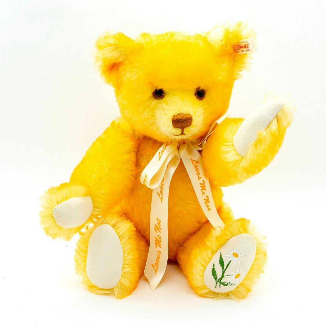 Steiff Teddy Bear, Loves Me Loves Me Not: Fully jointed, mohair, glass eyes, shaved snout Wearing a ribbon around neck. Flower embroidered on bottom paw. Original tag attached. Issued: 2001 Dimensions: 15"H Manufacturer: Steiff Country of Ori
