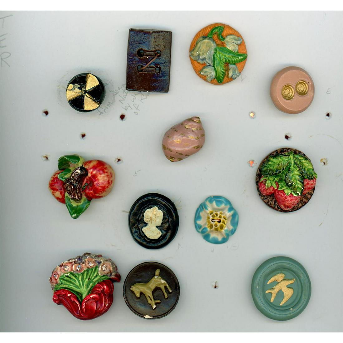 A CARD OF ASSORTED PLASTER BUTTONS (1 of 2)