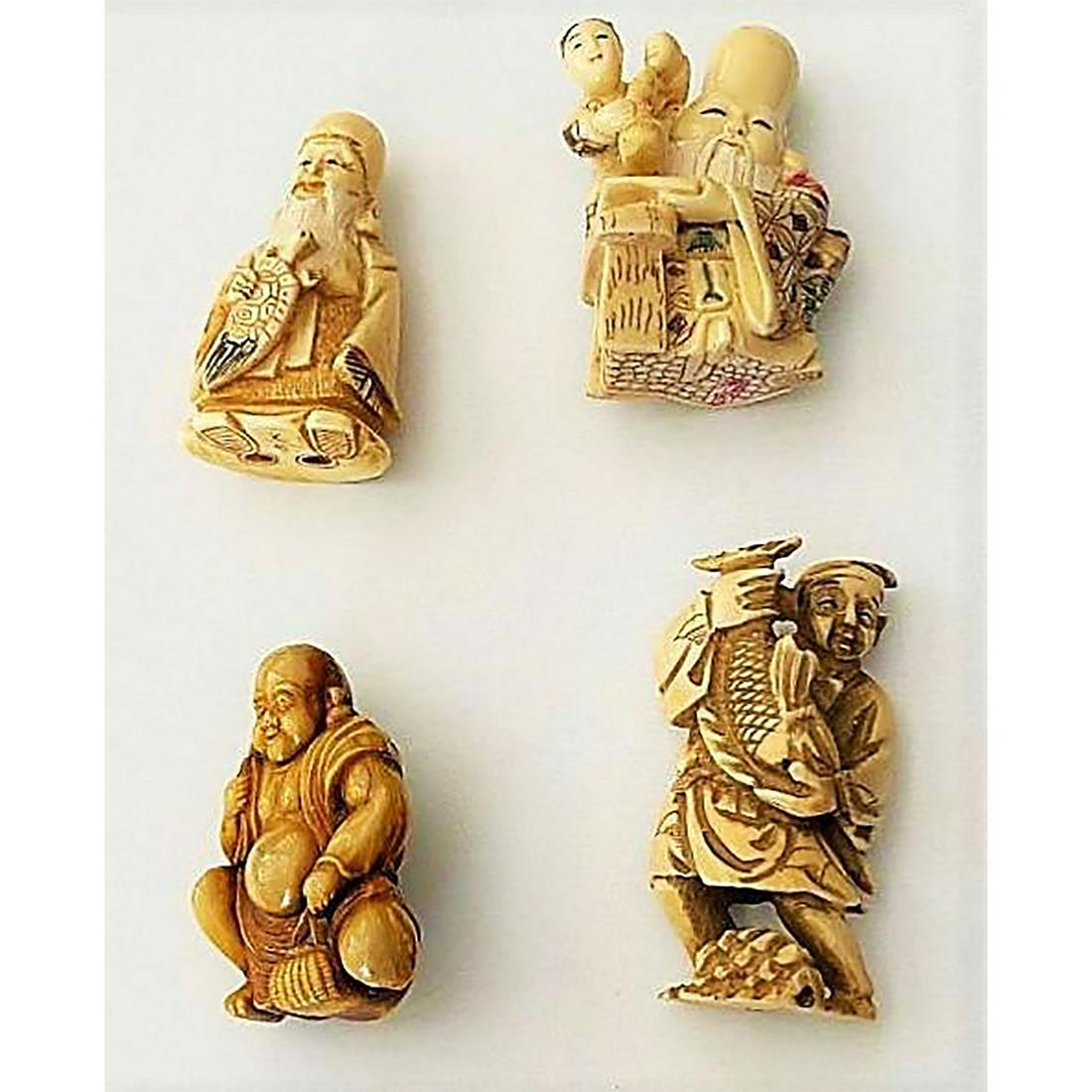 A SMALL CARD OF CARVED NETSUKE FIGURES.: 4 Large natural material early 20th century Netsukes. These 4 examples from Japanese carvers are quite detailed and in wonderful condition. The Japanese did not use buttons but they did use Netsukes o