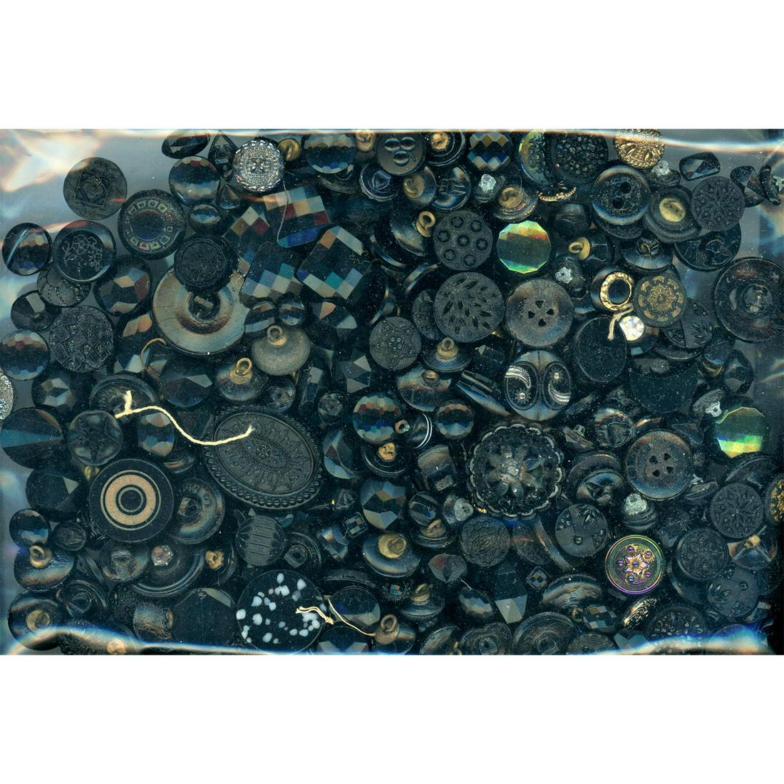 A HEAVY BAG LOT OF ASSORTED BLACK GLASS BUTTONS (1 of 2)