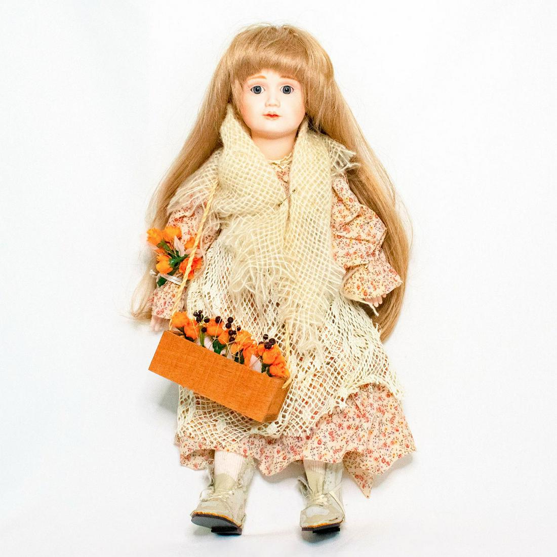Cindy M. McClure Porcelain Doll, Floral Dress and: Doll with grey eyes, blonde hair, soft body and porcelain face, arms, and legs. Designed by Cindy M. McClure. Doll wears a floral-patterned dress with a crocheted apron around the waist and knit shawl