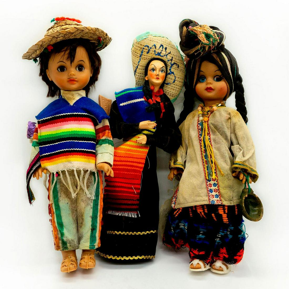 3pc Mexican Folk Art Plastic Dolls: Vintage souvenir dolls Mexico. Hard plastic body. 2 dolls have blinking eyes. Dolls are holding a ceramic pot and a plastic toy rifle. Measurements Girl with blinking eyes - 13.5"H. Boy with blinking 