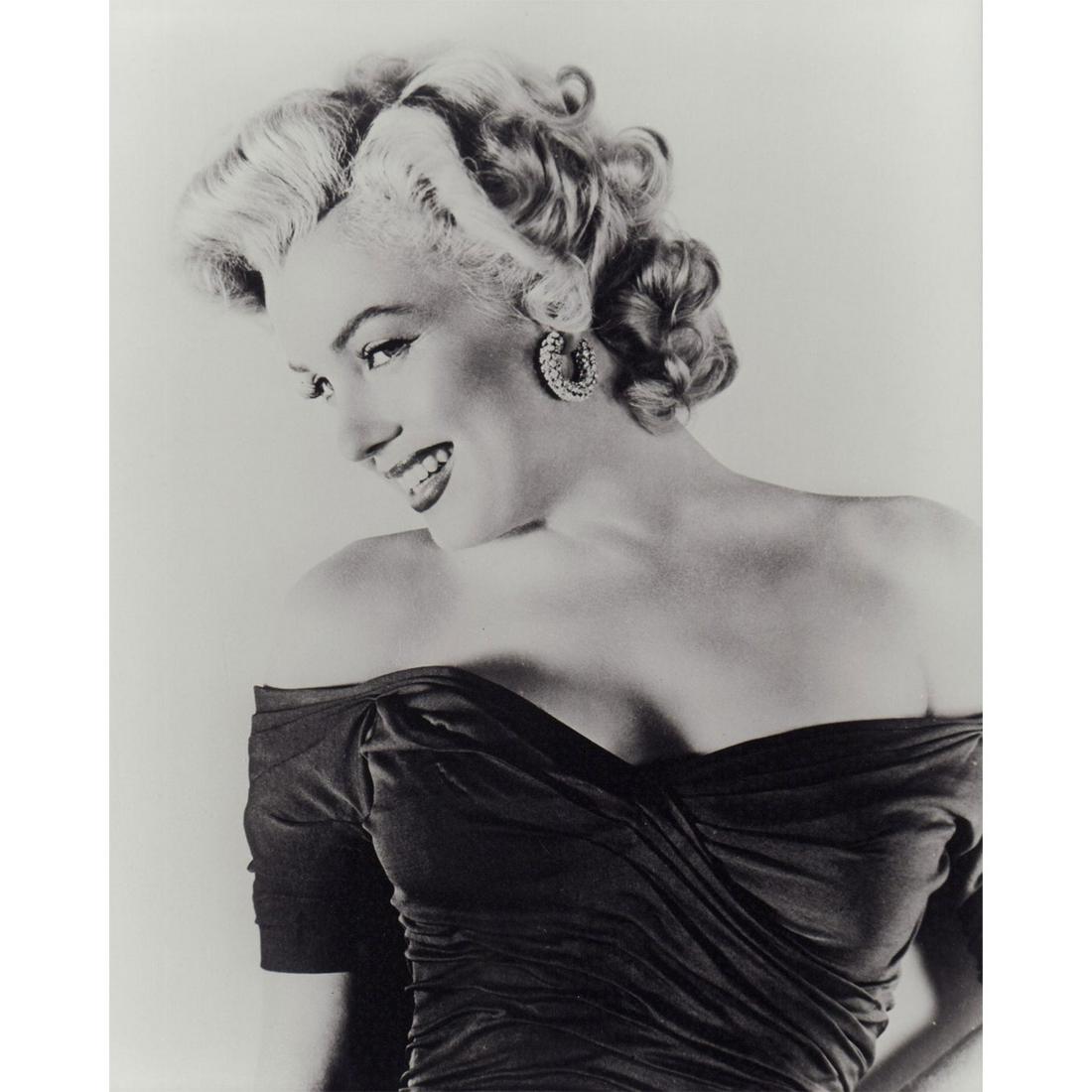 Marilyn Monroe Photograph: Black and white portrait photo of Marilyn Monroe wearing hoop earrings and an off-shoulder top. #marilynmonroe #oldhollywood #normajeane Issued: c. 1952 Dimensions: 8"W x 10"H Country of Origin: USA