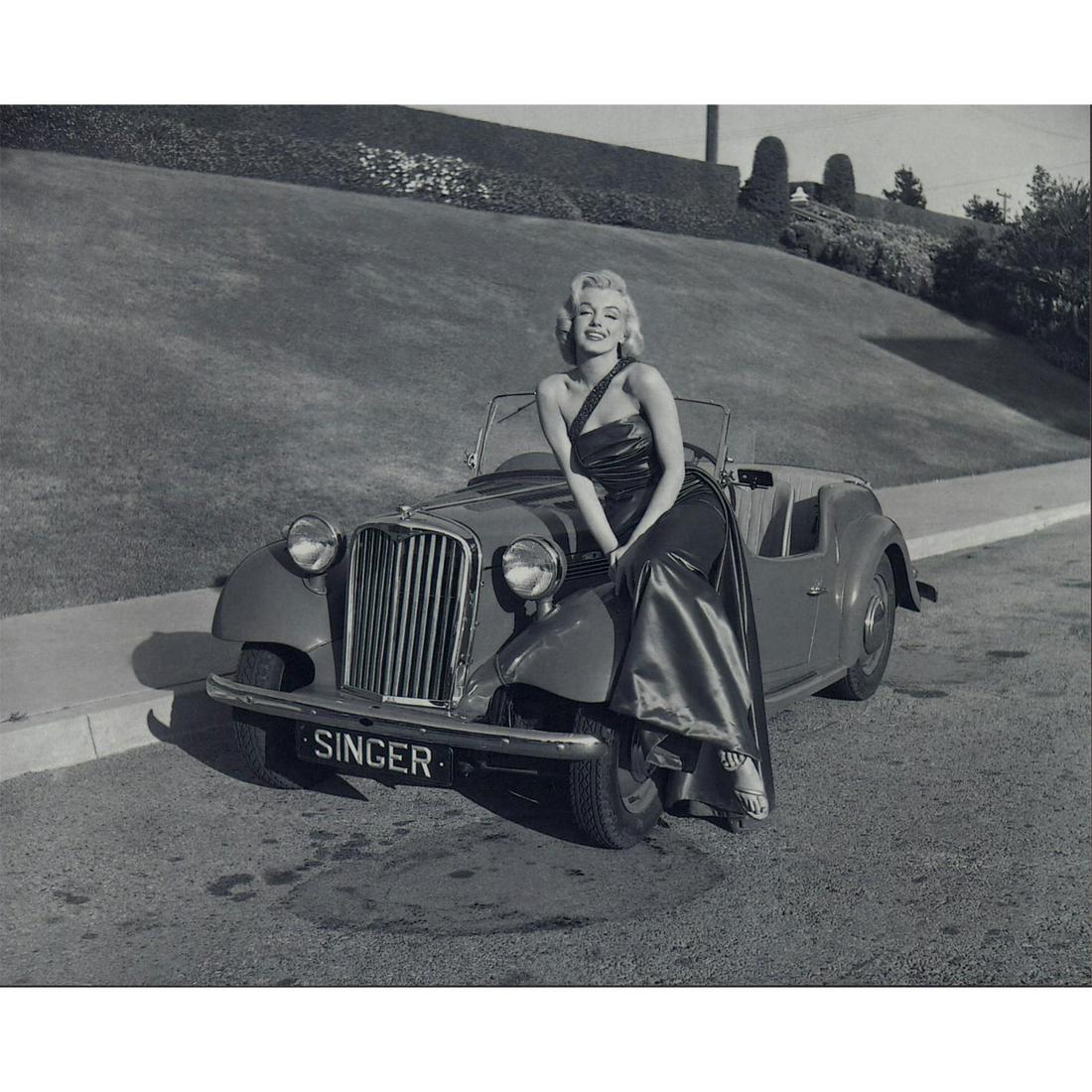 Marilyn Monroe Photograph: Photo of Marilyn Monroe sitting on a Singer SM1500 Roadster car, photographed by Frank Worth on the set of How to Marry a Millionaire in 1953. Printed on Fujicolor Crystal Archive paper. #marilynmonro