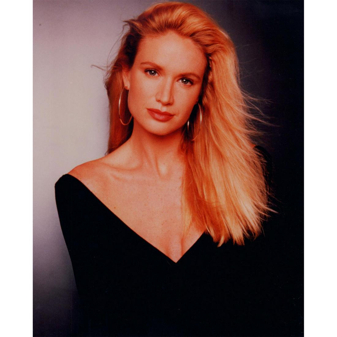 Celebrity Photograph: Celebrity portrait photo of a blonde woman wearing hoop earrings and a deep V-neck top. Printed on Kodak Professional paper. #celebrityphoto #model #actress Issued: c. 1990 Dimensions: 8"W x 10"H