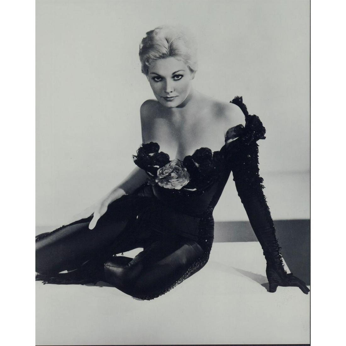 Kim Novak Photograph: Promotional photo of actress Kim Novak wearing a black one-shouldered outfit, on the set of the 1957 film Pal Joey. Printed on Fujicolor Crystal Archive paper. #kimnovak #paljoey Issued: 1957 Dimensio