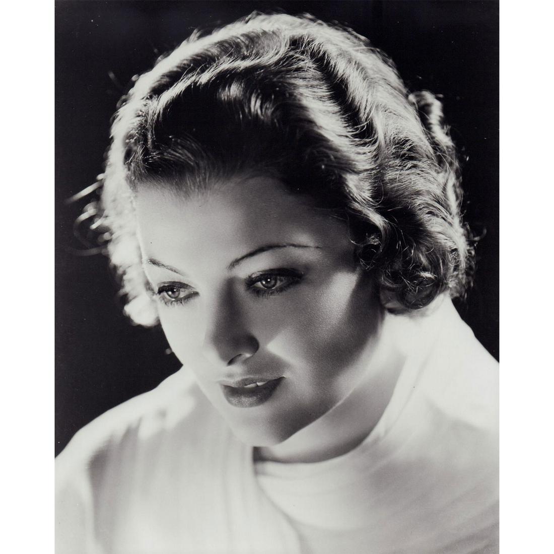 Myrna Loy Photograph: Black and white studio portrait of American actress Myrna Loy wearing a white top. #myrnaloy #oldhollywood Issued: c. 1930 Dimensions: 8"W x 10"H Country of Origin: USA