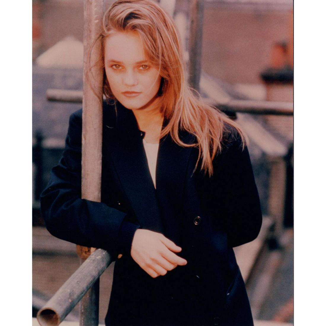 Vanessa Paradis Photograph: Portrait photo of French singer, model, and actress Vanessa Paradis wearing a dark coat. Printed on Kodak Professional paper. #VanessaParadis Issued: c. 1987 Dimensions: 8"W x 10"H