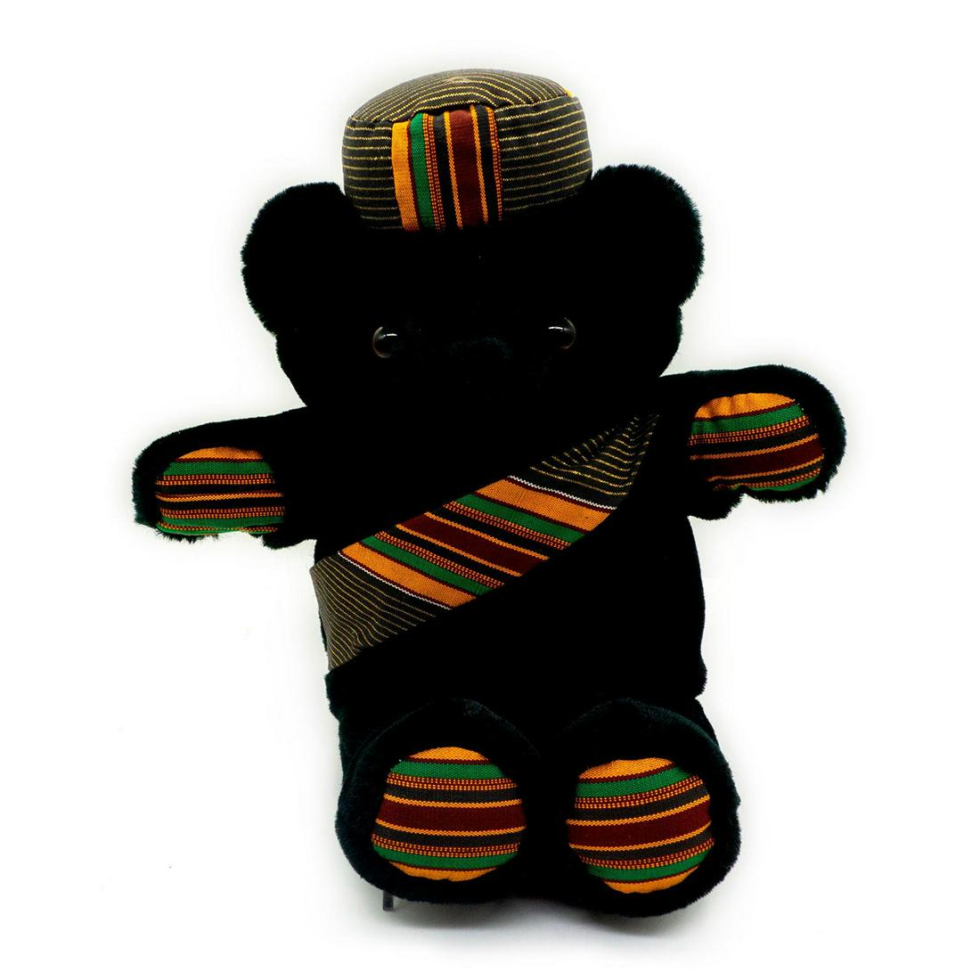 Ashanti Kingdom Teddy Bear, Kwesi: Royal family bear collection black teddy bear with orange, green striped paws hat and sash. Manufacturers tag with acrylic fur and brown eyeballs. Issued: 1993 Dimensions: 17"H Manufacturer: ABC Inter