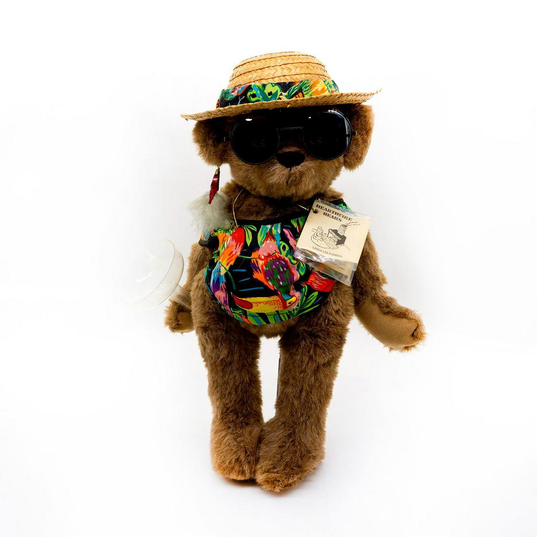 Hearthfire Bears Teddy Bear, Jimmy Bearffett: Fully jointed, mohair, glass eyes, sewn nose. Wearing a pop colored shirt with a straw hat that matches. Also has cool sunglasses on while carrying a margarita glass. Original tags attached and displa