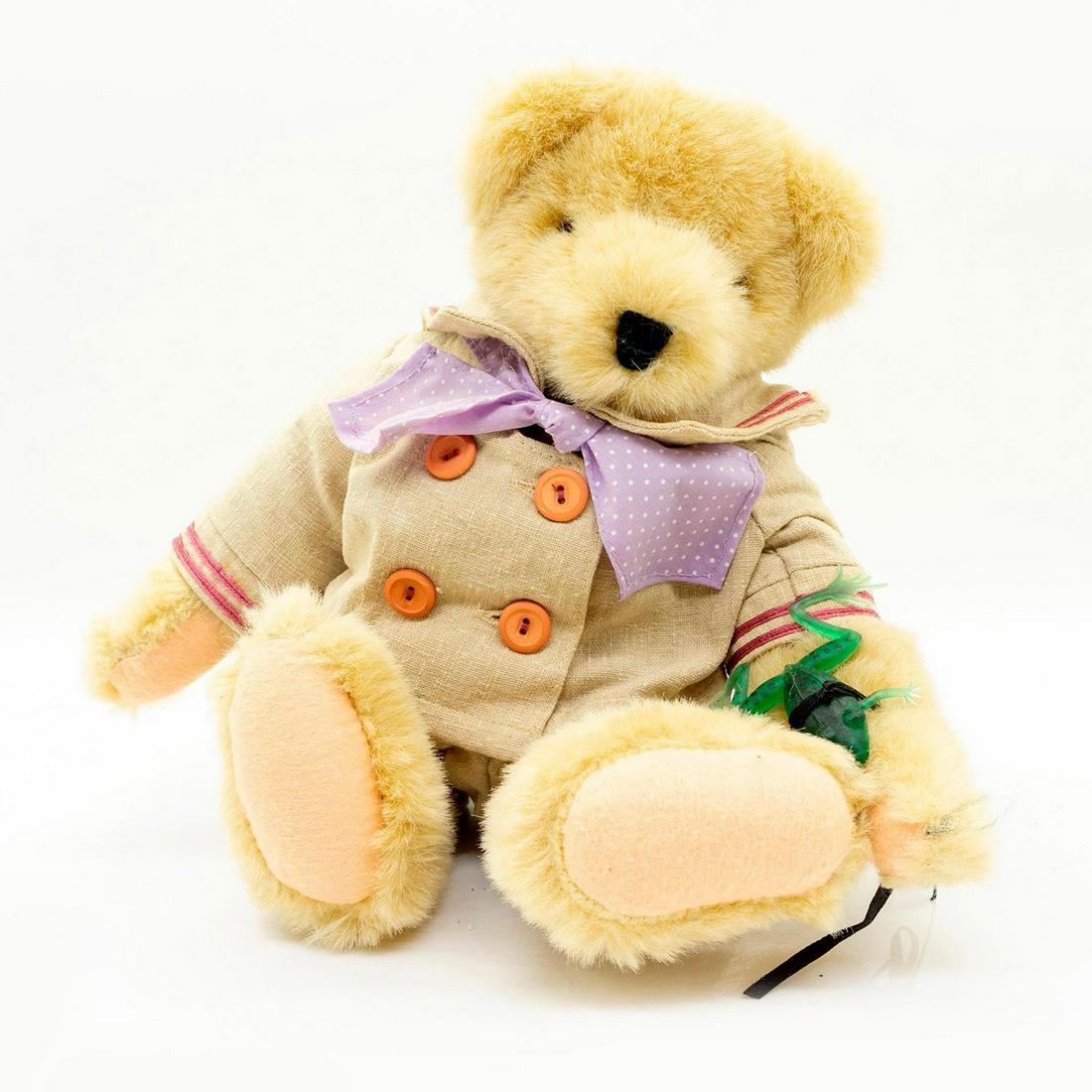 North American Bear Co Teddy Bear, Gibearny: Formal tan suit with purple polka dot bowtie. Rubber frog attached to wrist. Impressionist collection. Fully jointed. Manufacturer tag attached. Artist: Odl Bauer Manufacturer: North American Bear Co.