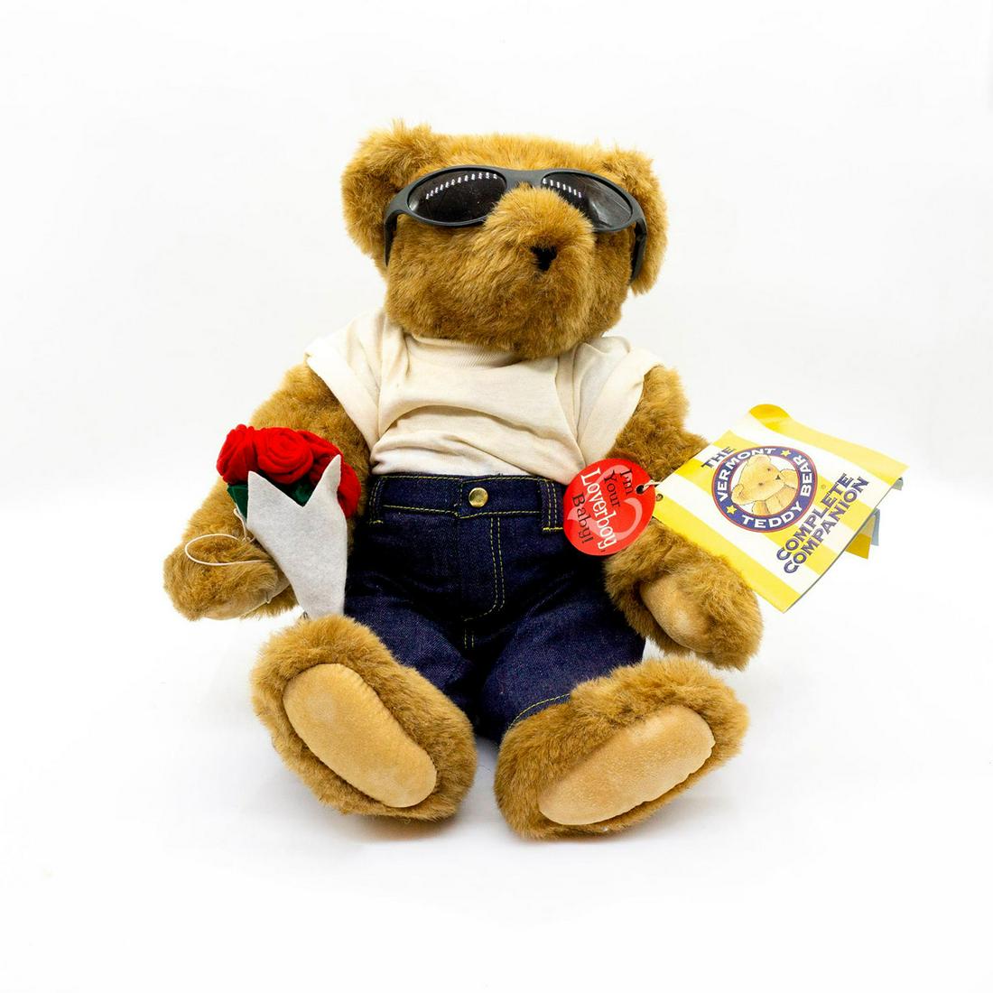 Vermont Teddy Bear Company Teddy Bear, Lover Boy: Triple jointed, glass eyed, tan plush. Stylish sunglasses, muscle t shirt to impress the ladies, and slick jeans. Comes holding a bouquet of roses. All original tags attached. Issued: 20th c. Dimensio