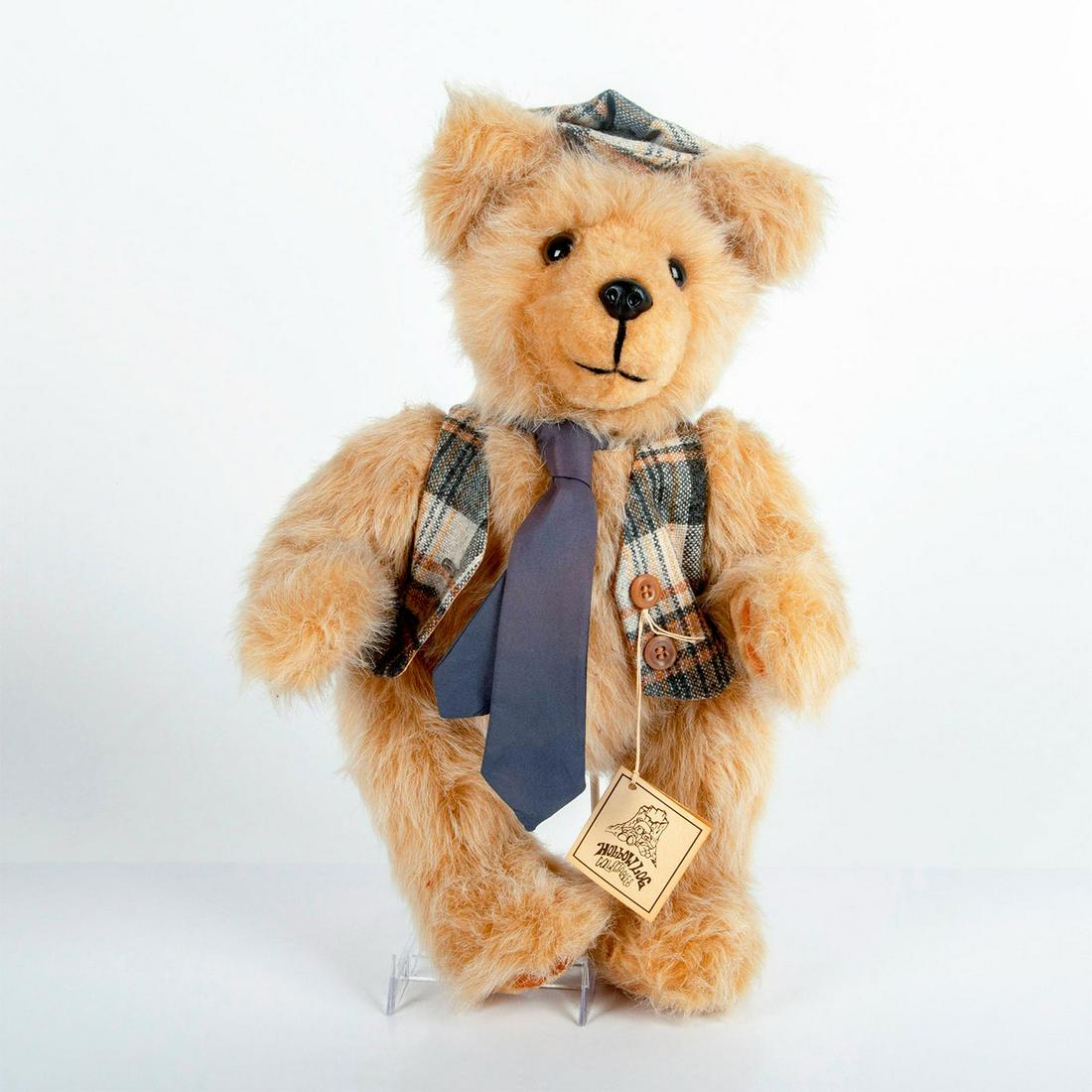 Vintage Hollow Log Collectables Teddy Bear, Little: Articulated; gold dyed mohair. Wears vest and tie with matching hat. Complete with Hollow Log Collectables tag. Issued: 20th c. Dimensions: 16"H Manufacturer: Hollow Log Collectables Country of Origin