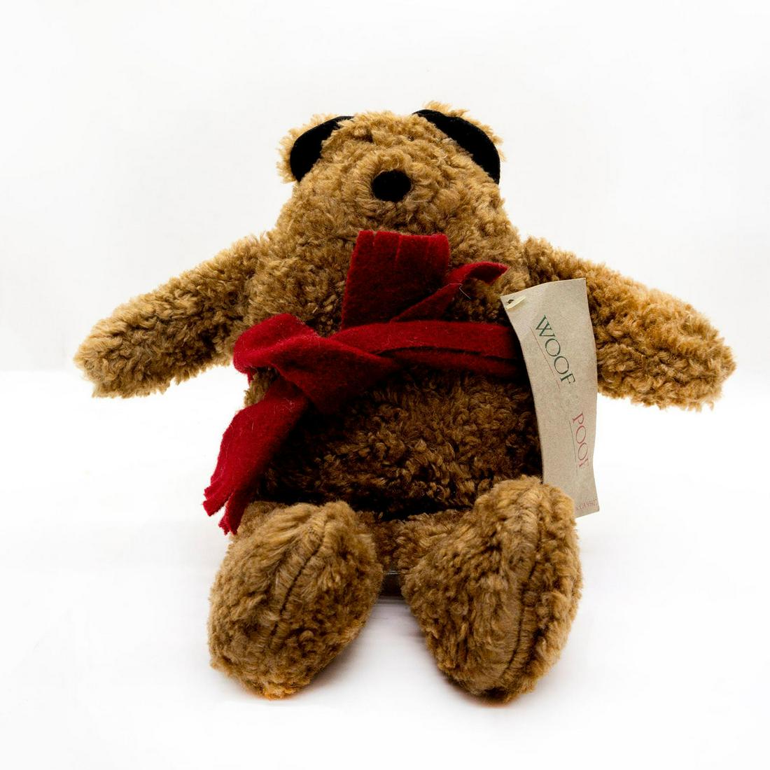 Woof Poof Musical Teddy Bear, Red Scarf: Brown plush, glass eyes, black velvet ears, original tag attached. Issued: 20th c. Manufacturer: Woof Poof Country of Origin: United States