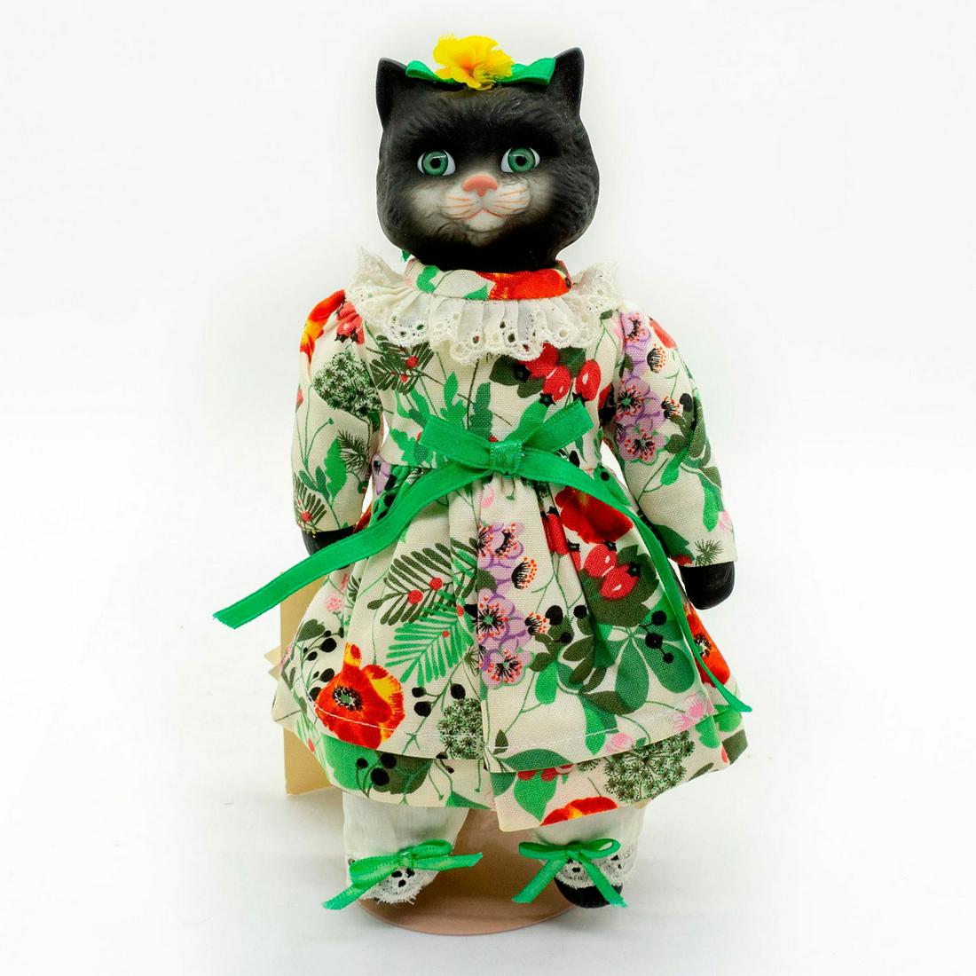 Goebel, Whiskers Maine Coon Cat Porcelain Doll: Limited edition 762 of 2,000. Victoria Ashlea Originals series. Lovely black cat porcelain doll is wearing a colorful botanical print dress. Comes with original tags and box. Artist: Karen Kennedy Iss