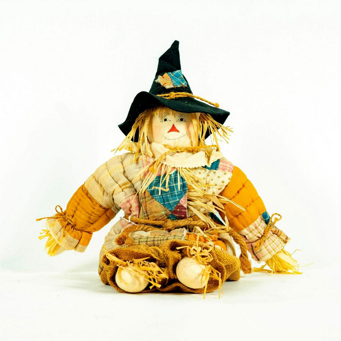 Vintage Scarecrow Doll: Stuffed doll rope belt and bows, quilted shirt, burlap pants and dark hat. Unmarked original tag attached to belt. Issued: 20th c. Dimensions: 20"H