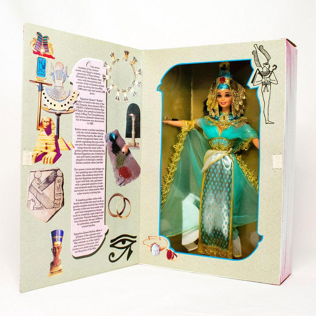 Mattel Barbie Doll, Egyptian Queen: From The Great Eras Collection, Barbie doll is an Egyptian queen in this royal costume capturing the essence of Egypt's Golden Age. She wears a dress including a white pleated skirt with a golden trim