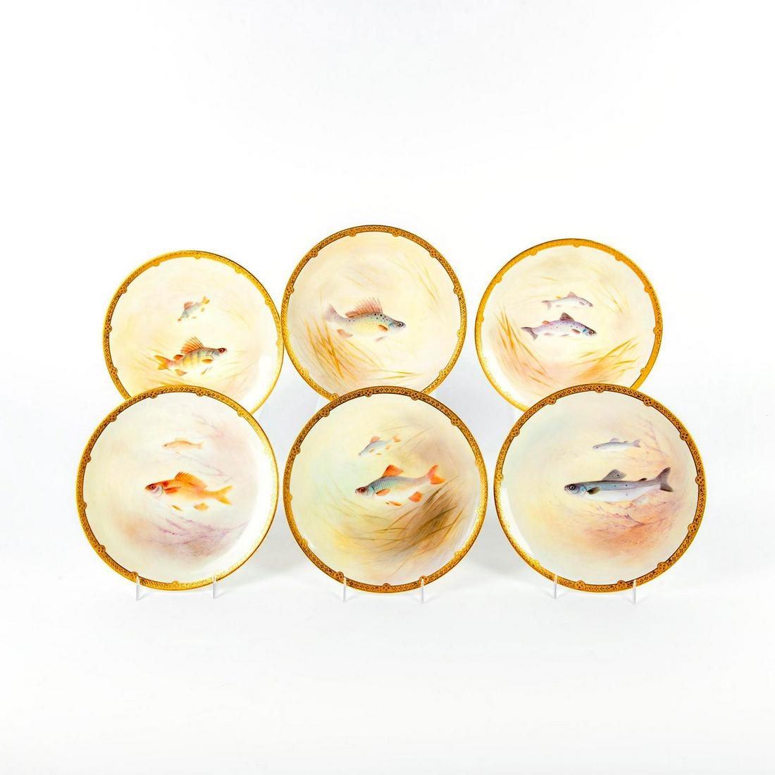 6 Royal Doulton Porcelain Plates, Fish: Exquisite set of plates with hand painted fish motif; gilt rim. Signed by artist. Includes depictions of Salmon, Rudd, Sea Bream, Salmon Trout, Ruffe and Perch. Titled on bases. Doulton backstamps. Is