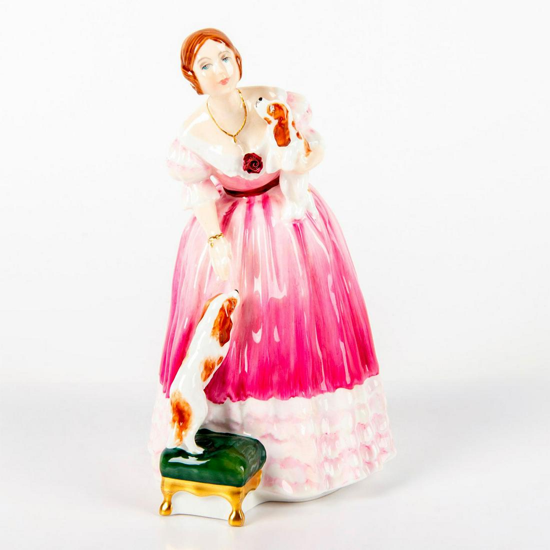 Queen Victoria HN3125 - Royal Doulton Figurine: Glazed porcelain figurine; woman in pink and white dress, leaning down to pet small dog on green leg chair. 3221 of 5000. Royal Doulton backstamp. Artist: Pauline Parsons Issued: 1988; Ltd. 5,000 Dime