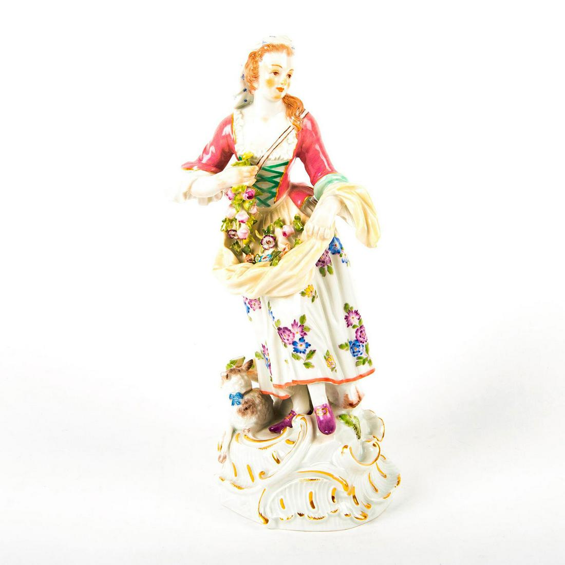 Meissen Style Porcelain Figurine, Shepherdess: Hand painted glazed porcelain figure; modelled as lady with sheep by her feet. Stunning figure with finely detailed floral design on dress; applied flowers; gilt accents. Crossed sword mark on undersi