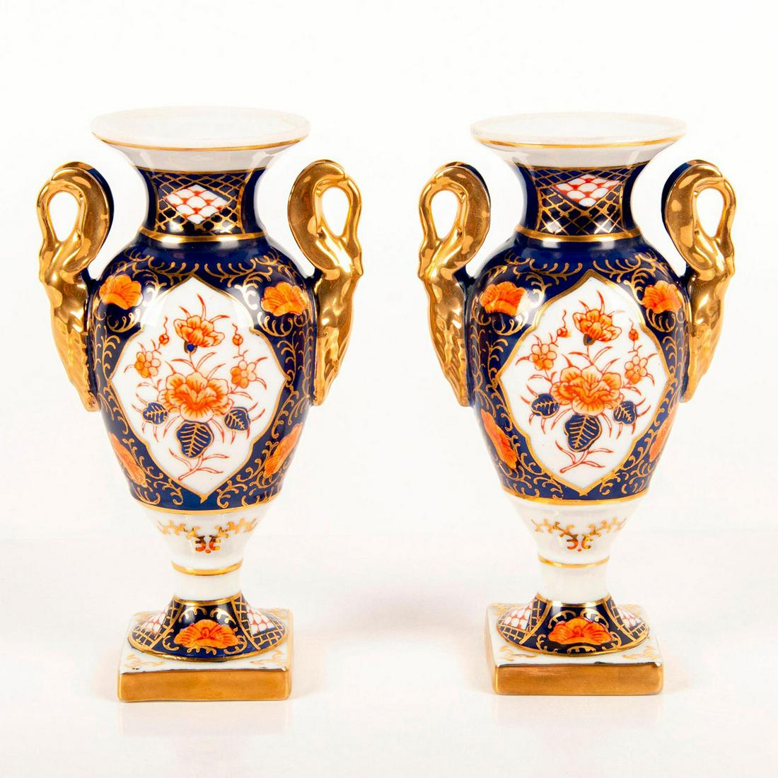 Pair Of Andrea By Sadek Vintage Porcelain Vases 7329: Gorgeous hand painted oriental floral design with gold gilt trim. Twin handles and square base. Andrea by Sadek sticker on one piece. Excellent condition. Issued: 20th c. Dimensions: 10.75"H Manufactu