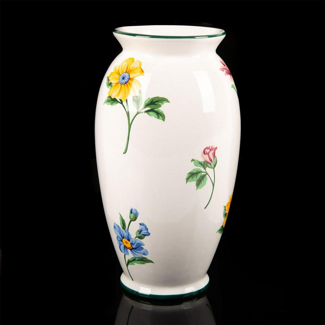 Tiffany Porcelain Flower Vase, Sintra: Delicate white glazed vase with a moss green ringed rim and base and multicolored flowers throughout. Tiffany & Co stamped on the bottom. Age related crazing and wear and tear. Small chip to bottom ba