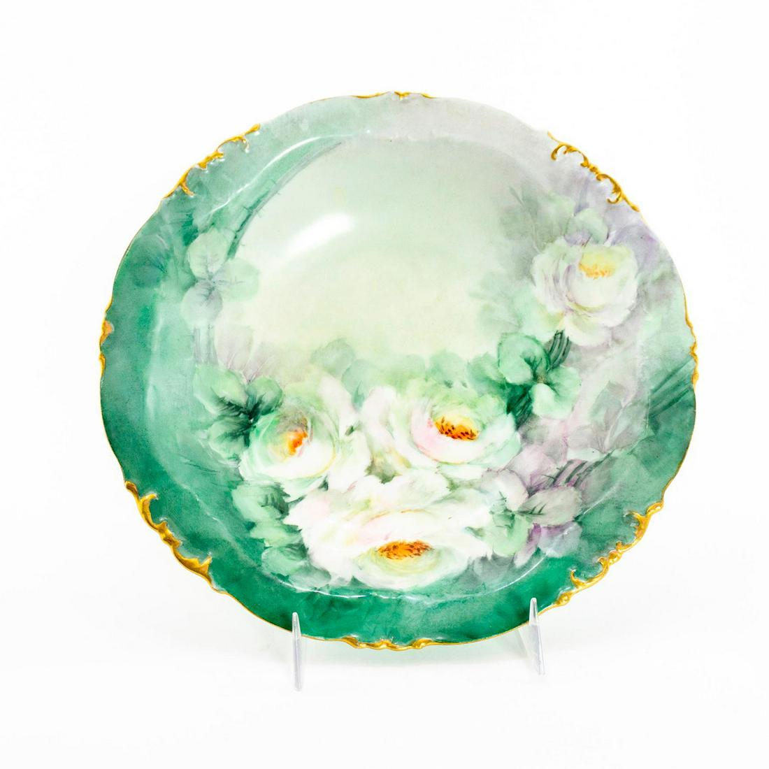 Charles Martin Limoges Floral Bowl: Stunning hand painted floral design on green ground; gilt accents on rim. Charles Martin Limoges backstamp. Use related wear. Issued: 20th c. Dimensions: 9" dia. Manufacturer: Charles Martin Limoges C