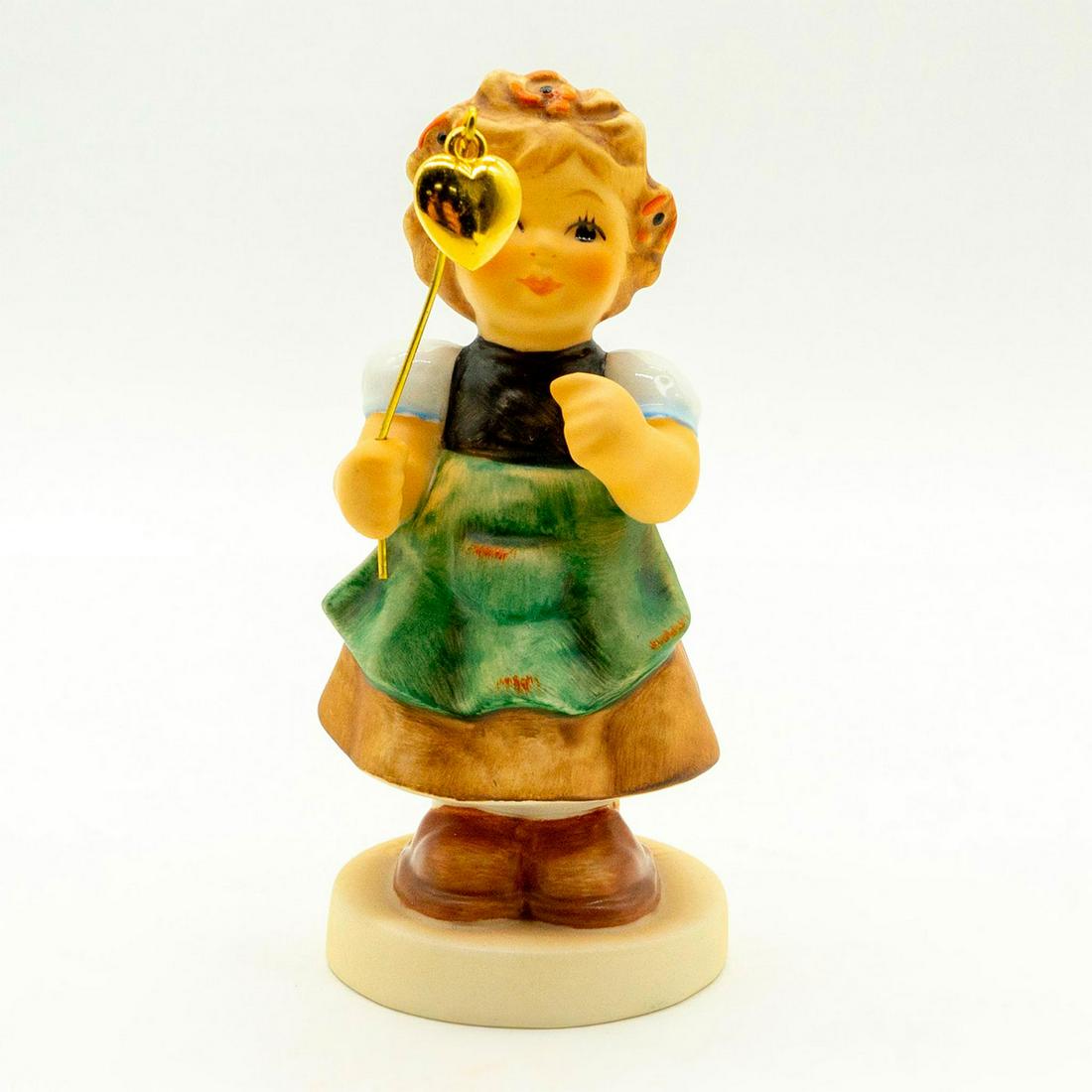 My Lucky Heart 2298 - Goebel Hummel Figure: Matte porcelain, hand painted. 2011 exclusive for Hummel Club members. 'M. I. Hummel' inscribed on base. Goebel backstamp. Good condition. #goebel #hummel #figurine #hummelclub Issued: 2008 Dimensions