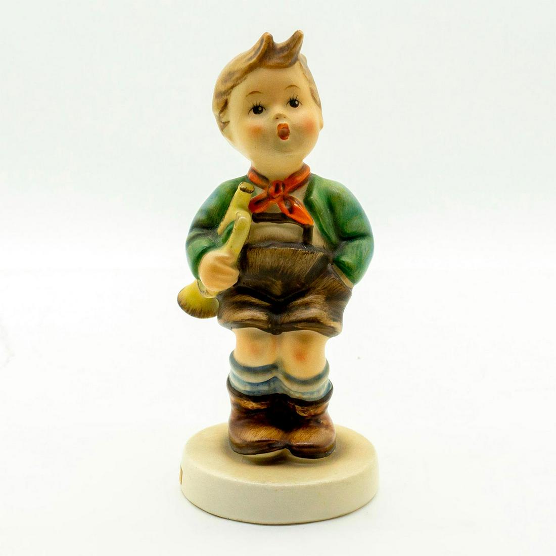 Trumpet Boy 97 - Goebel Hummel Figure: Matte porcelain, hand painted. Young boy in lederhosen holding his musical instrument. 'M. I. Hummel' inscribed on base. Goebel backstamp. Good condition. #goebel #hummel #figurine #vintage Issued: c.