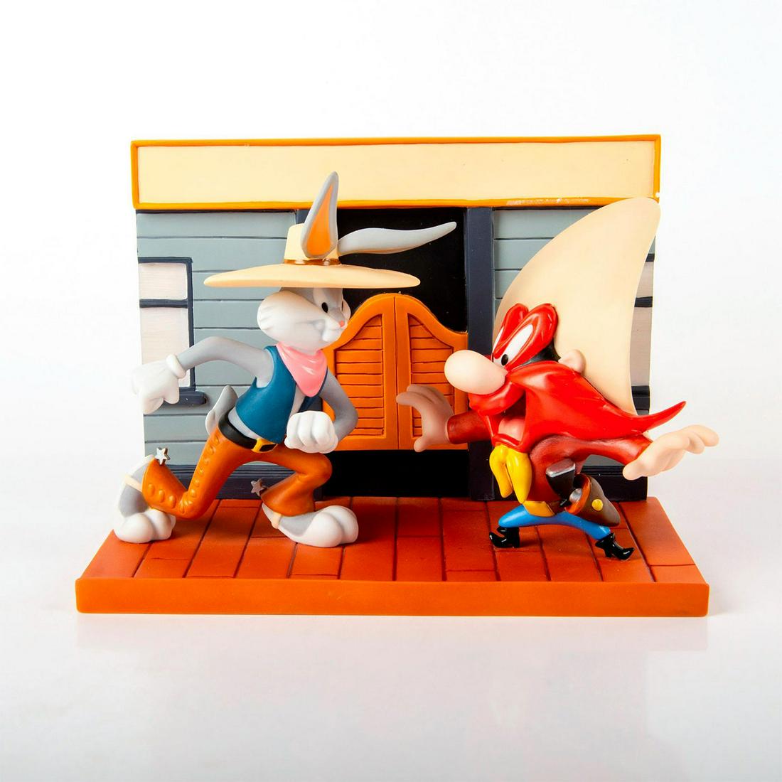 Warner Bros Looney Tunes Figurine, Saloon Showdown: Limited edition piece. Matte porcelain. Brown, gray, blue, and red coloration. Coalport Characters series. Excellent condition. With original box. #looneytunes #bugsbunny #yosemitesam #cartoon Issued: