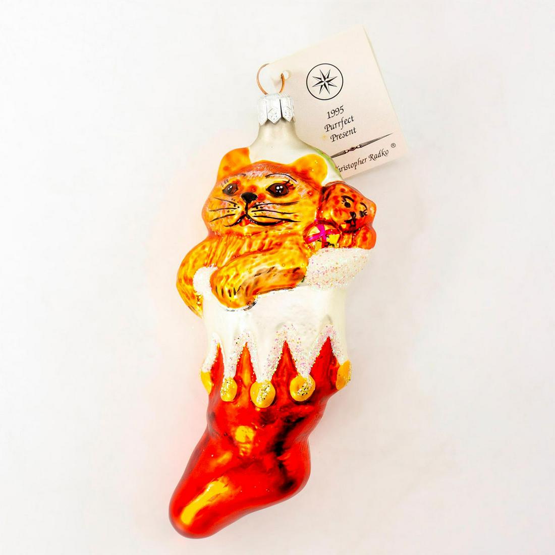 Christopher Radko Christmas Ornament, Purrfect Present: Lovely hand-painted small glass ornament of a brown kitten in Christmas stocking. Comes with original box. Includes original tag. Shows some wear. #Christmasornament #ChristmasTree #cat Artist: Christ