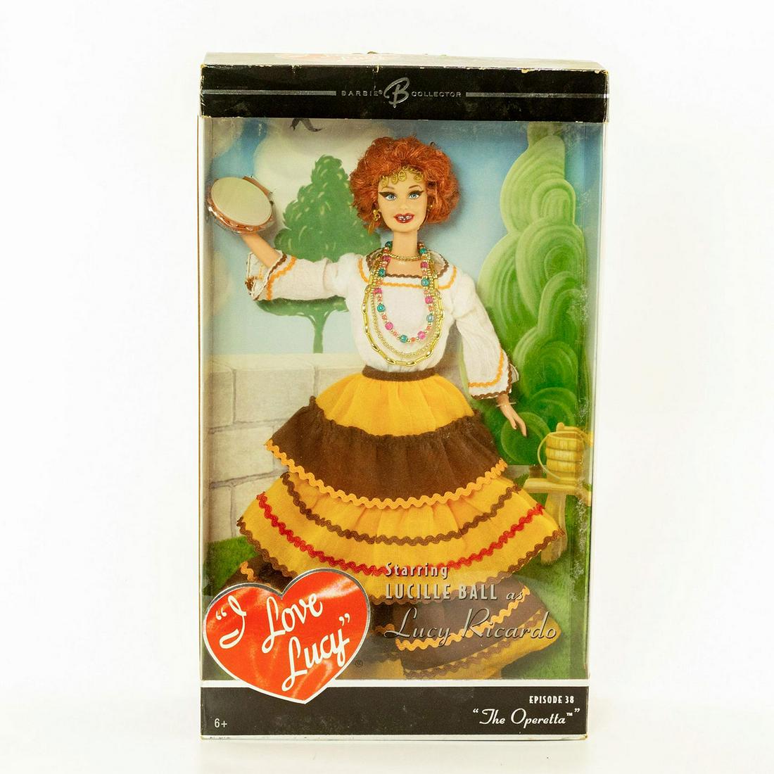 Mattel Barbie Doll, I Love Lucy, The Operetta: Lucy Ricardo from I love Lucy the TV series. Dressed in yellow, brown and white attire with tambourine. With original, sealed box. Issued: 2005 Manufacturer: Mattel Country of Origin: Indonesia