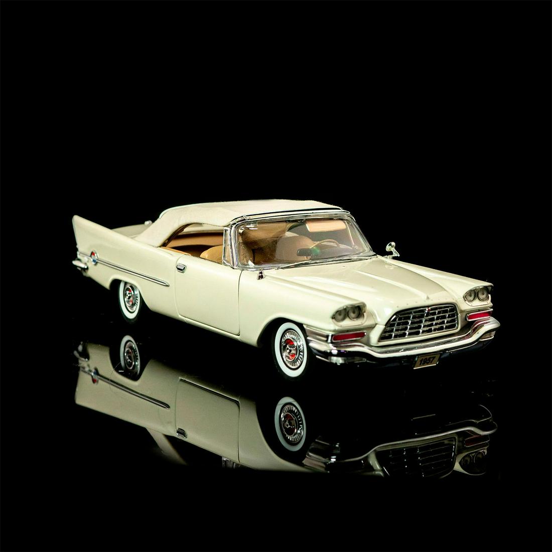 Danbury Mint, 1957 Chrysler 300C Car: Glazed; Off white exterior with chrome accents and beige interior. Convertible. With original box. Automobilia and Americana Issued: 19th c. Dimensions: 9"L Manufacturer: Danbury Mint Country of Origi